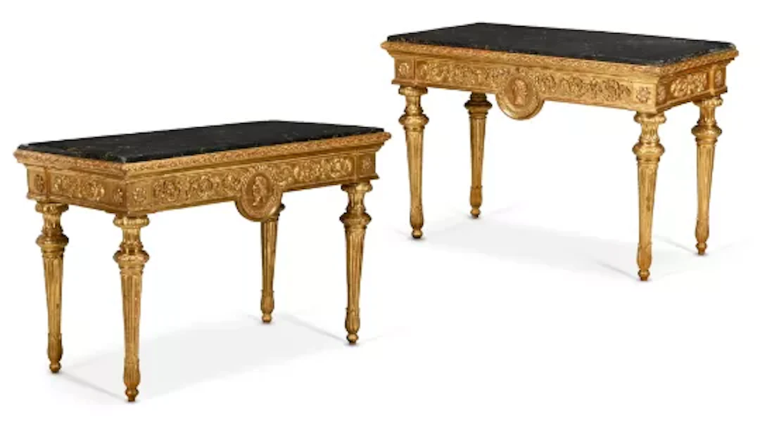 A PAIR OF ITALIAN CARVED GILTWOOD AND PORTORO MARBLE TOPPED CONSOLE
