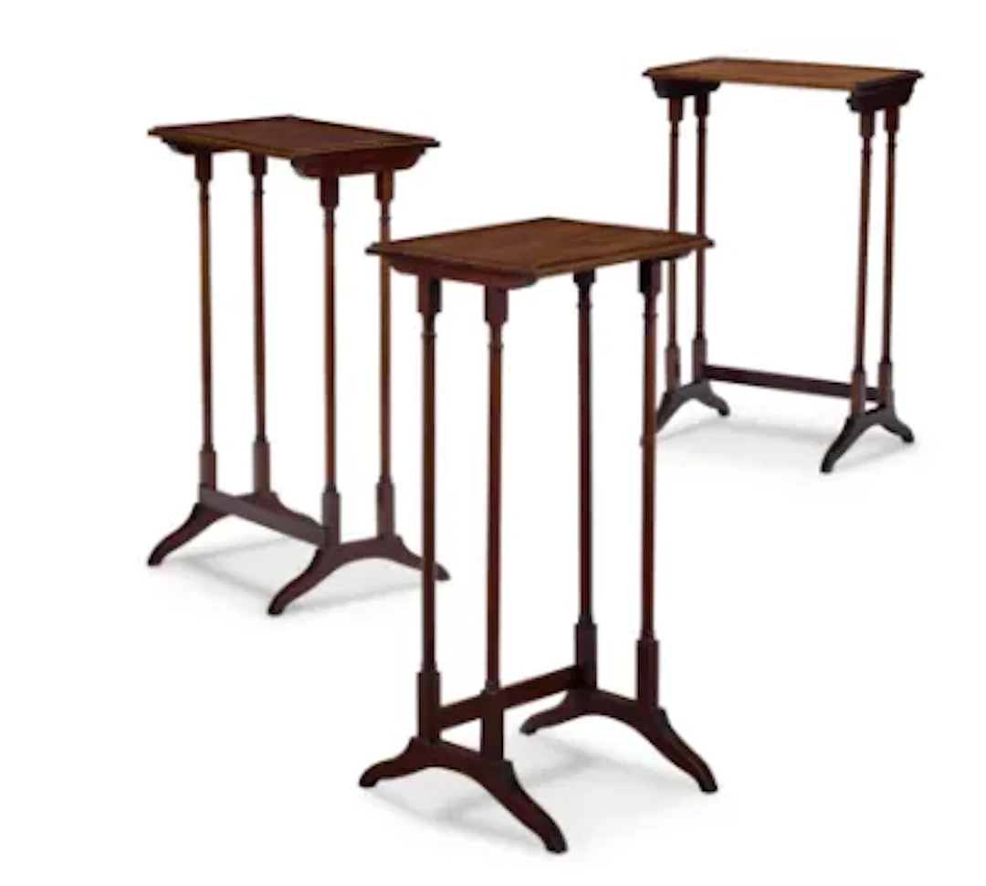 A SET OF THREE MAHOGANY NESTING OCCASIONAL TABLES, IN REGENCY STYLE