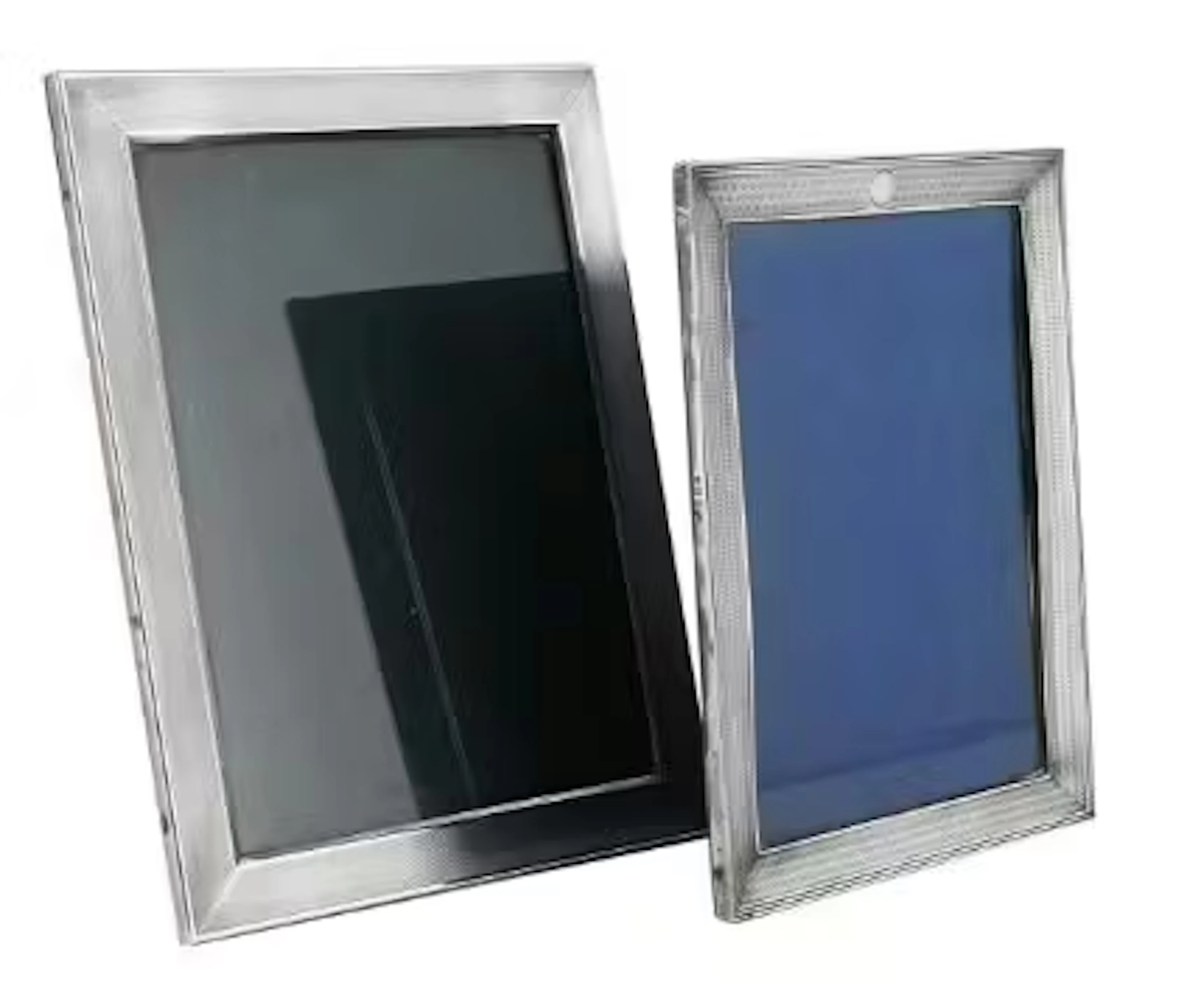 TWO SILVER MOUNTED AND ENGINE TURNED RECTANGULAR PHOTO FRAMES