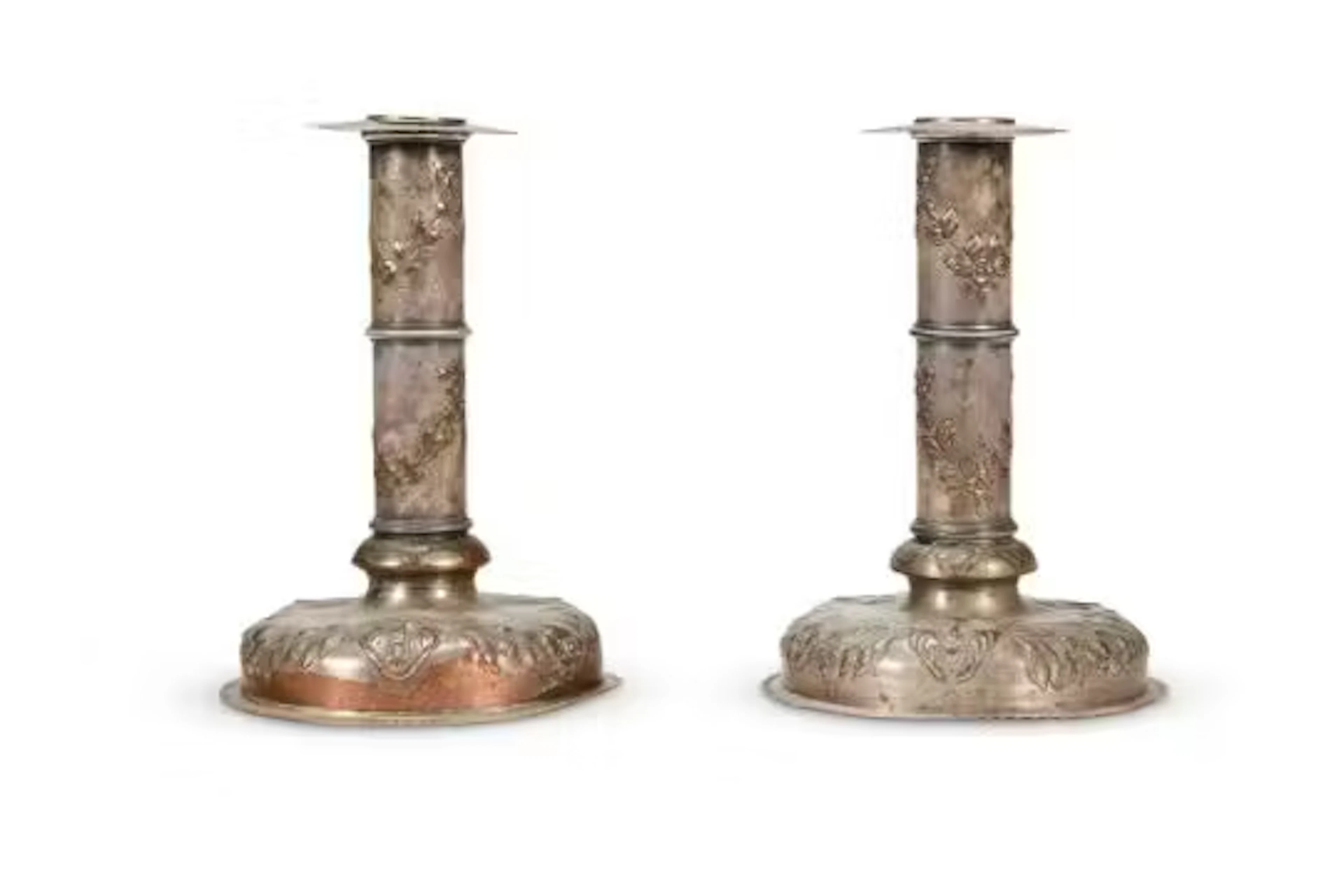 A PAIR OF SILVER PLATED COPPER CANDLESTICKS, PROBABLY NORTH EUROPEAN