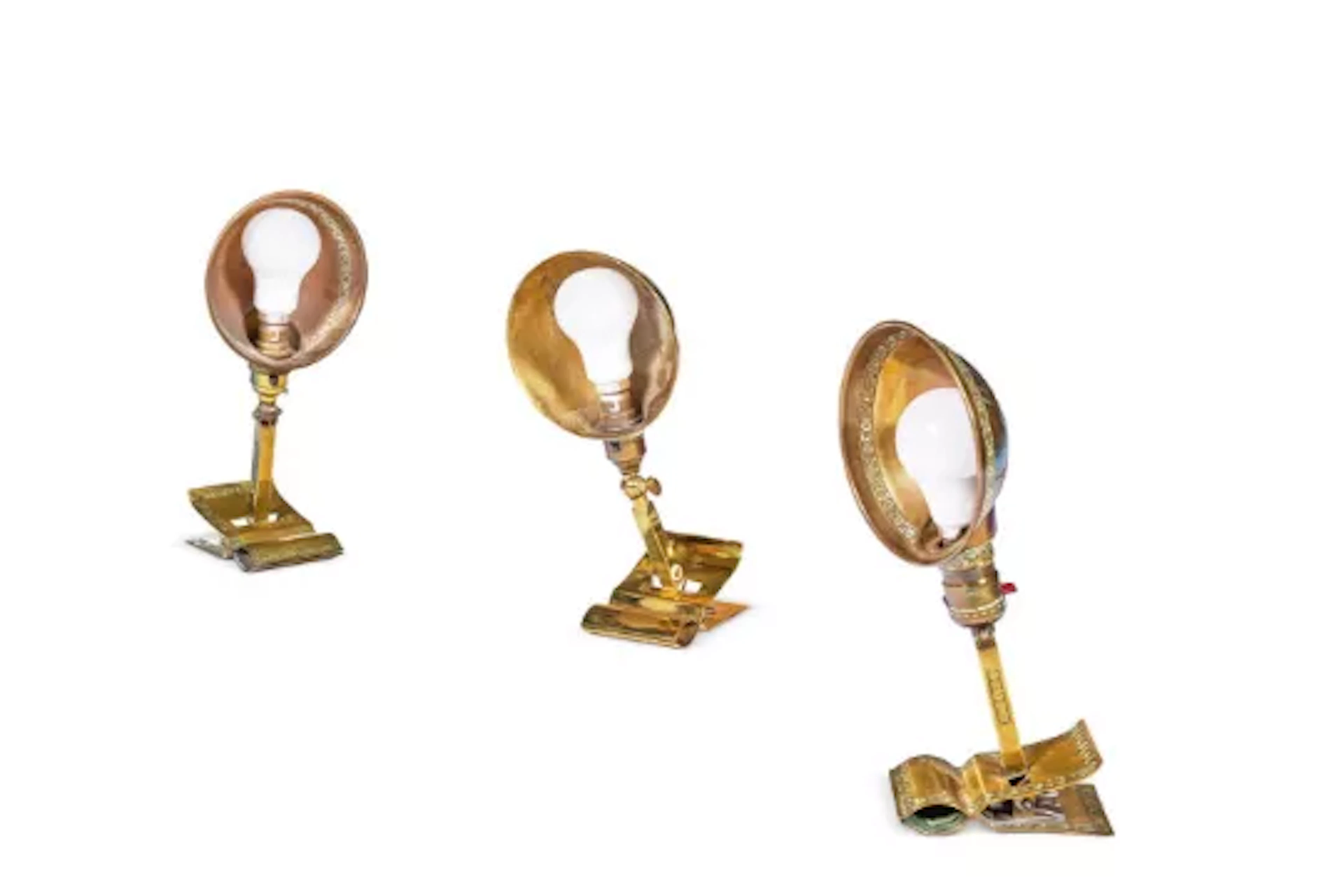 THREE BRASS CLIP-ON DESK LIGHTS, TWO EARLY 20TH CENTURY