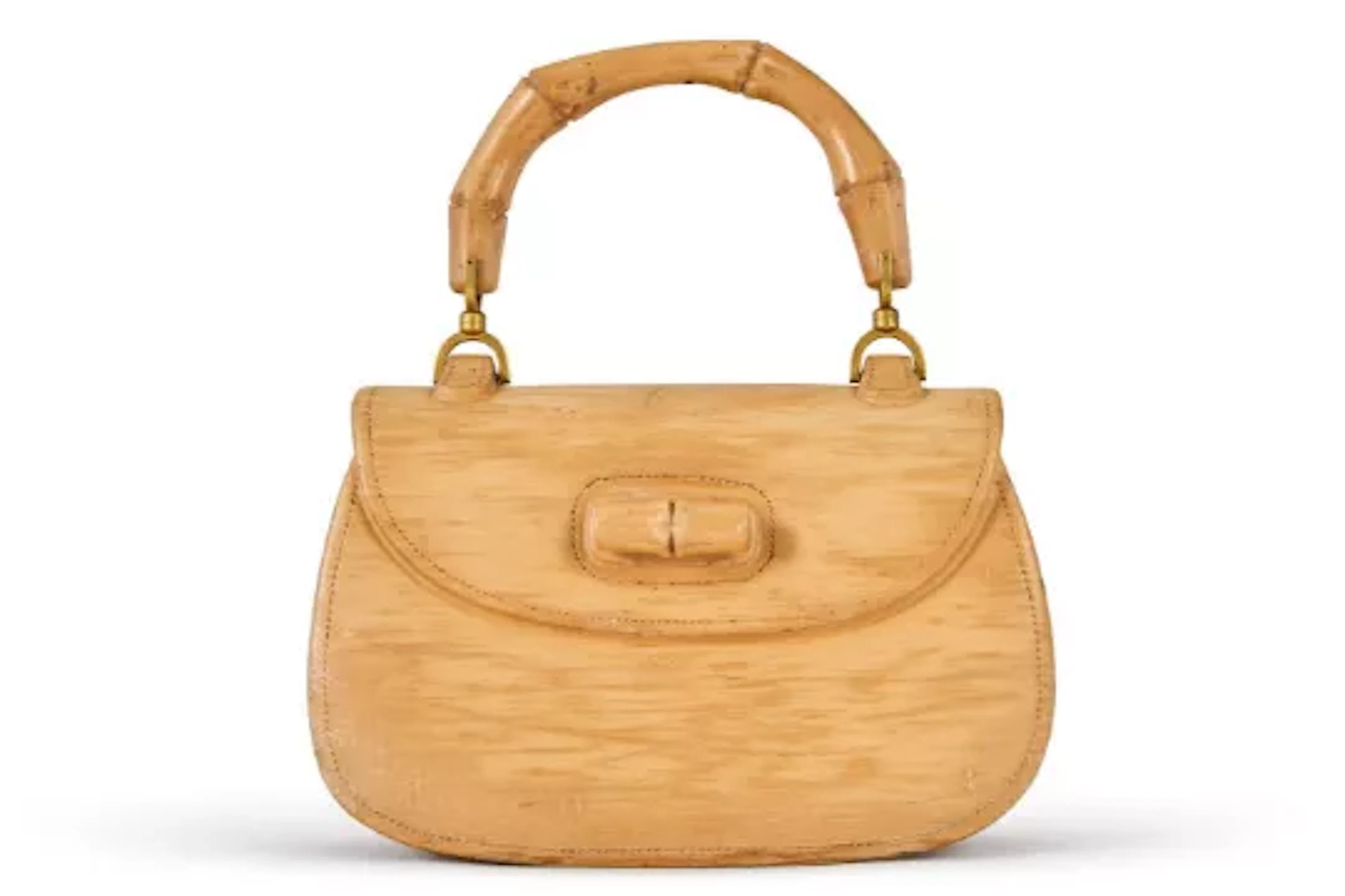 GUCCI, AN UNUSUAL GILT METAL MOUNTED SOLID CARVED WOOD DISPLAY '1947' HANDBAG