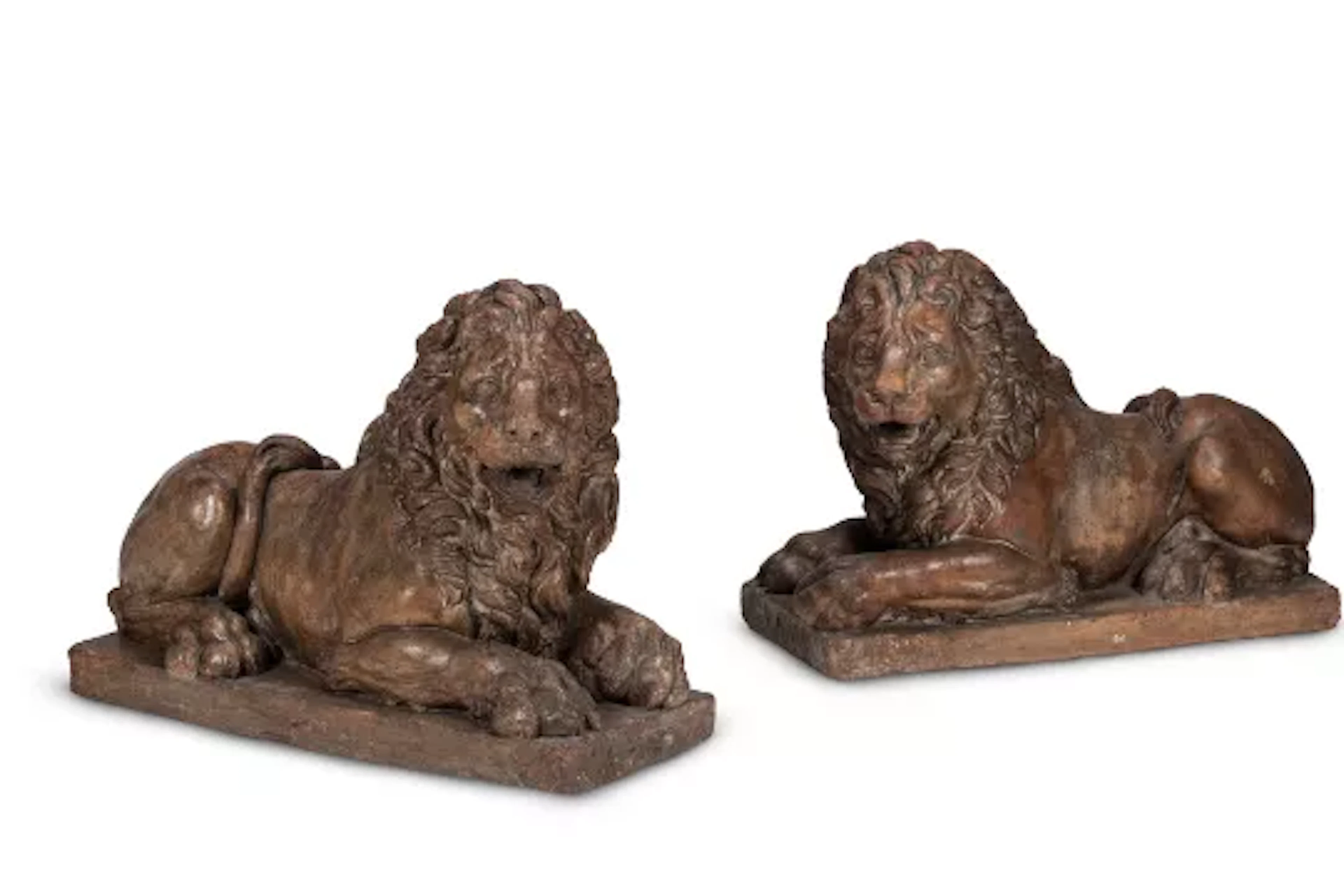 A LARGE PAIR OF RECUMBENT TERRACOTTA LIONS, ITALIAN, 18TH CENTURY
