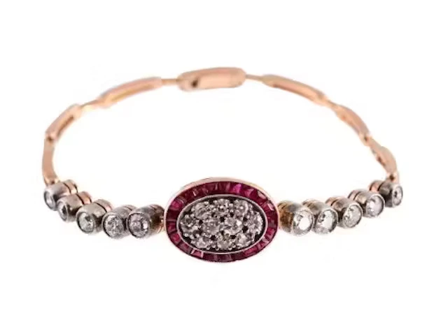AN EARLY 20TH CENTURY DIAMOND AND SYNTHETIC RUBY BRACELET