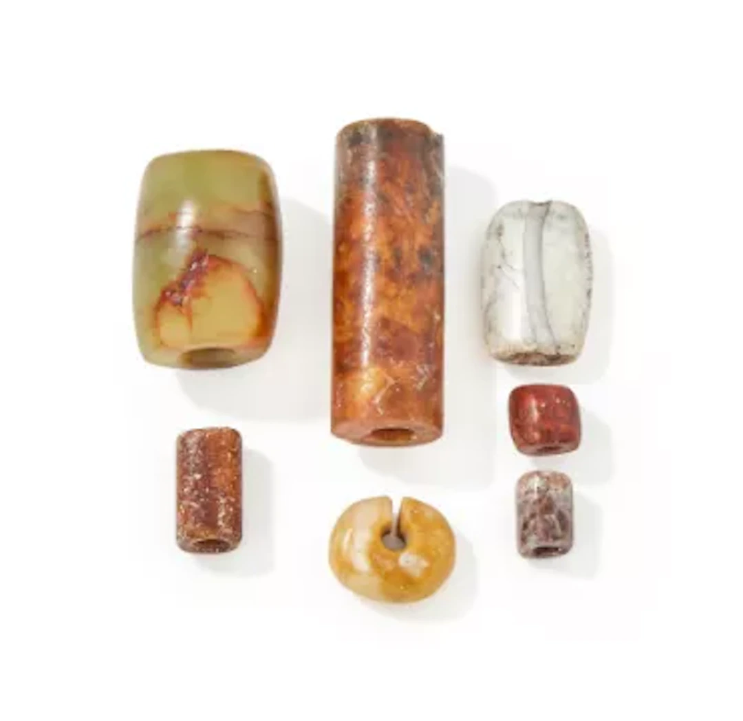 A group of seven assorted Chinese jade beads, Neolithic period