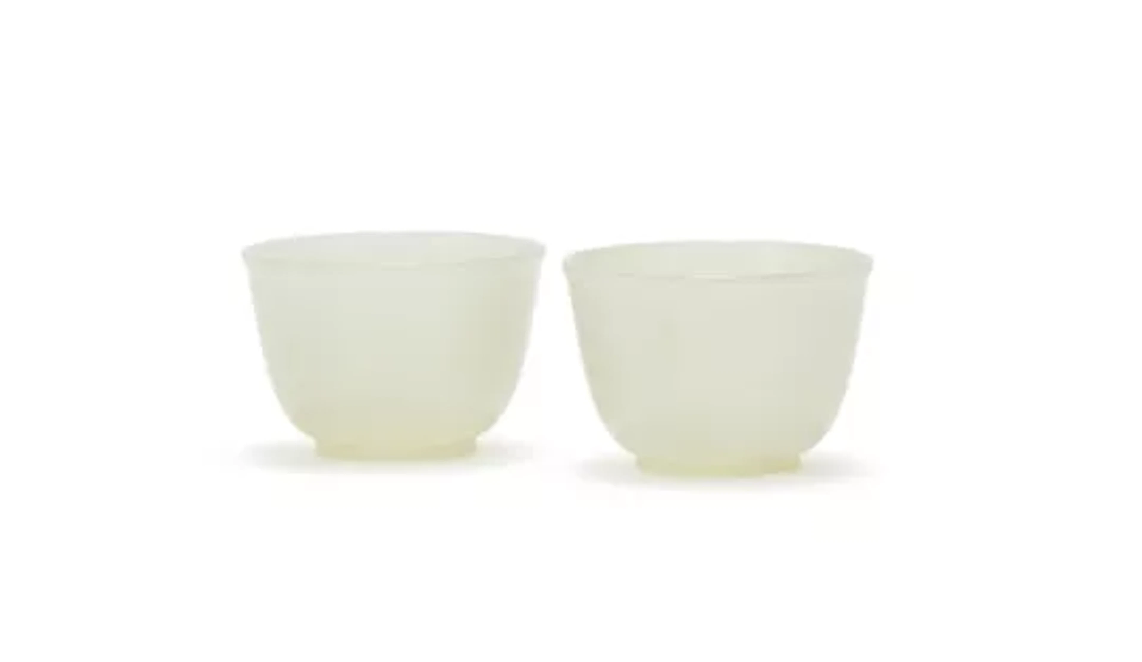 A pair of Chinese white jade cups, 18th/19th century