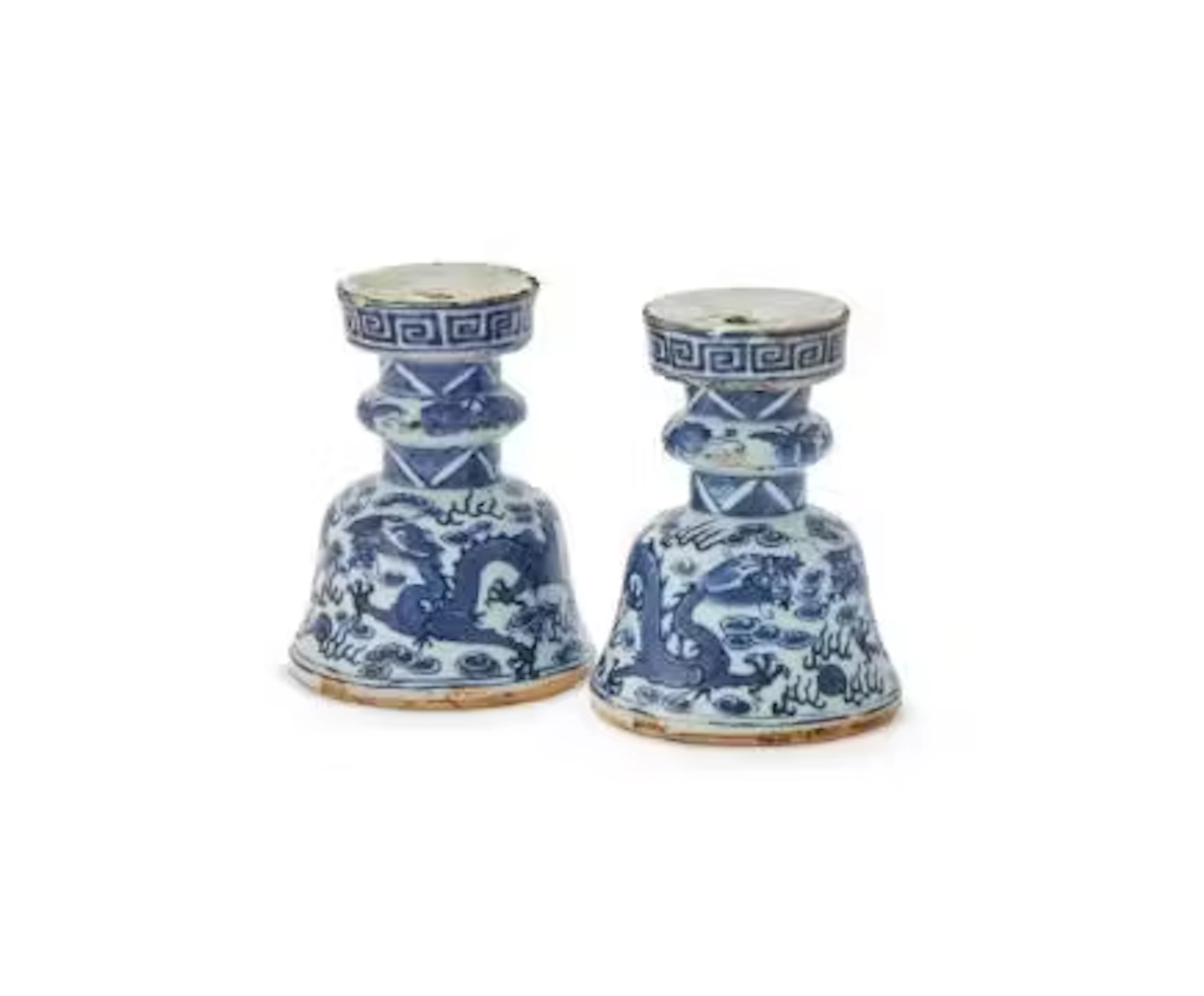 A pair of Chinese blue and white 'dragon' candle holders