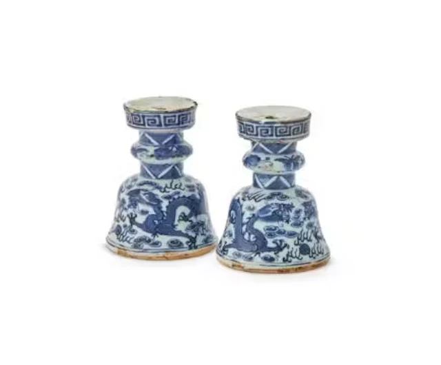 A pair of Chinese blue and white 'dragon' candle holders