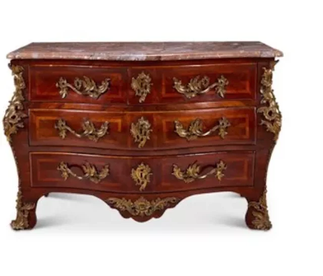 A LOUIS XV ORMOLU MOUNTED PADOUK AND BOIS SATINE BOMBE COMMODE, BY