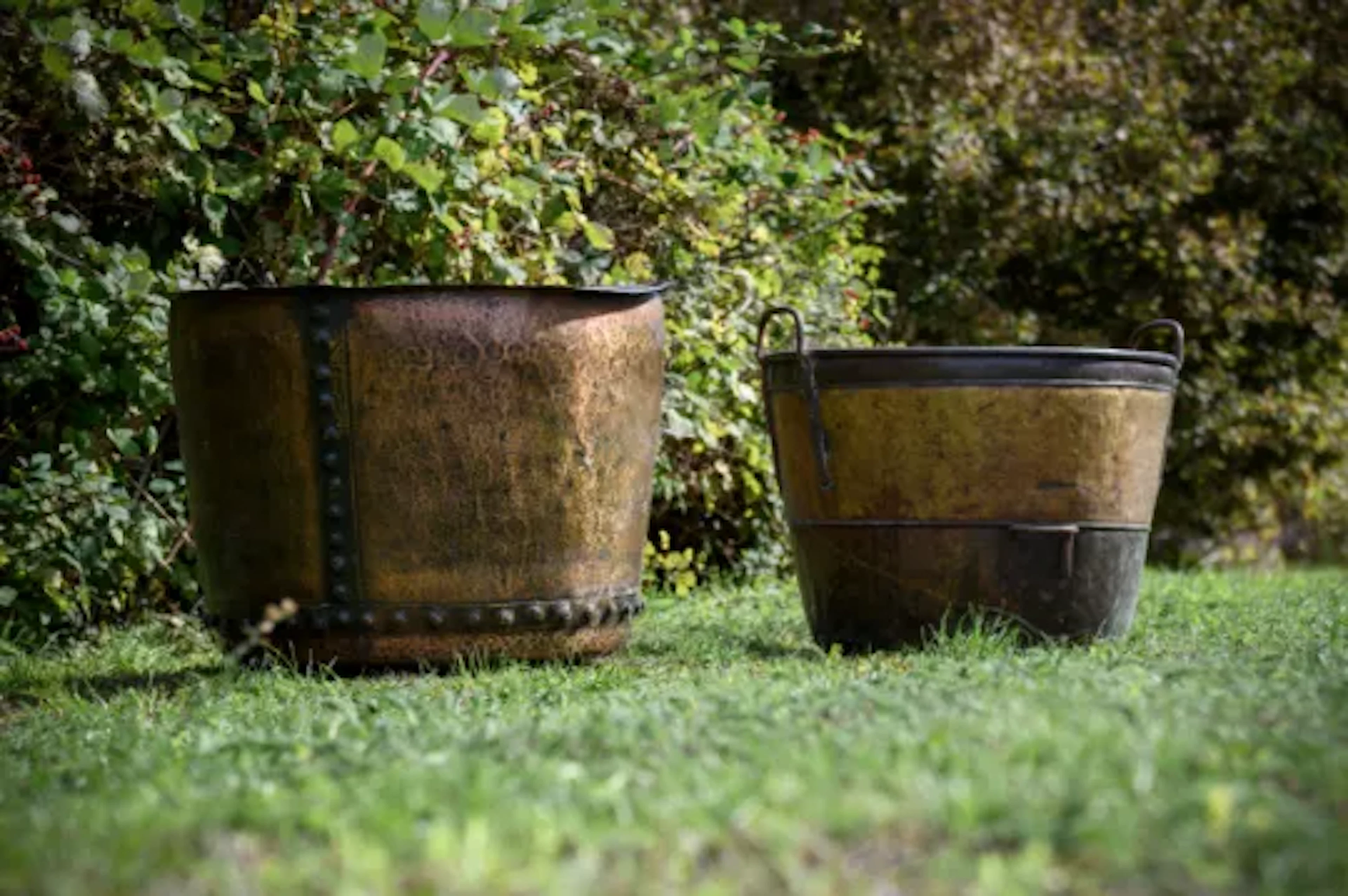 TWO LARGE METAL GARDEN LOG BINS OR PLANTERS, LATE 19TH CENTURY
