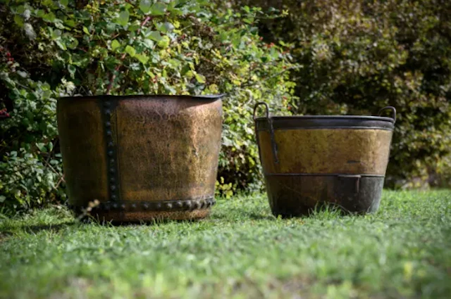 TWO LARGE METAL GARDEN LOG BINS OR PLANTERS, LATE 19TH CENTURY