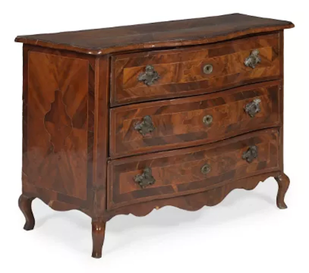 A MALTESE WALNUT, OLIVEWOOD AND FRUITWOOD SERPENTINE COMMODE, SECOND