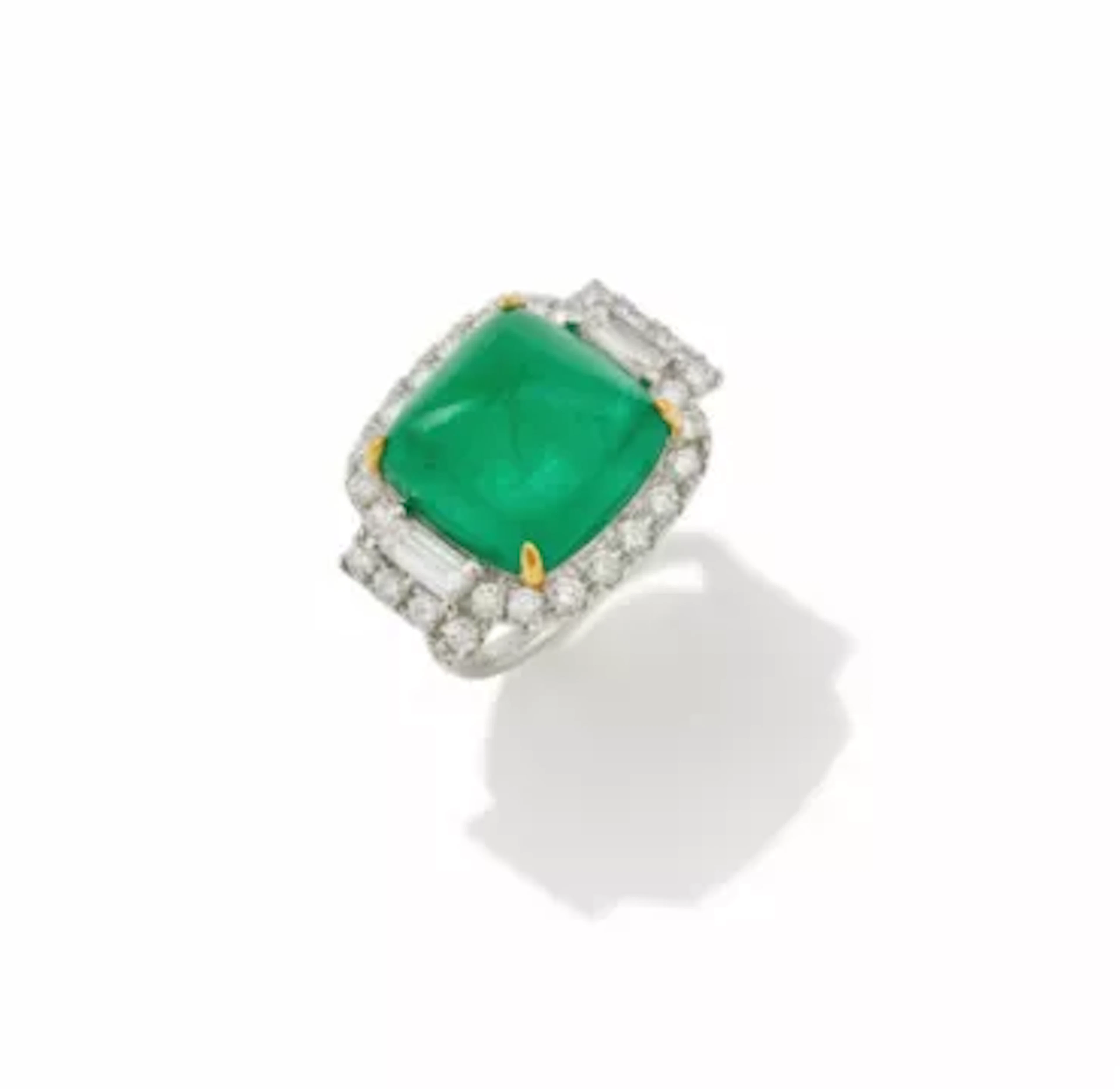 AN EMERALD AND DIAMOND DRESS RING