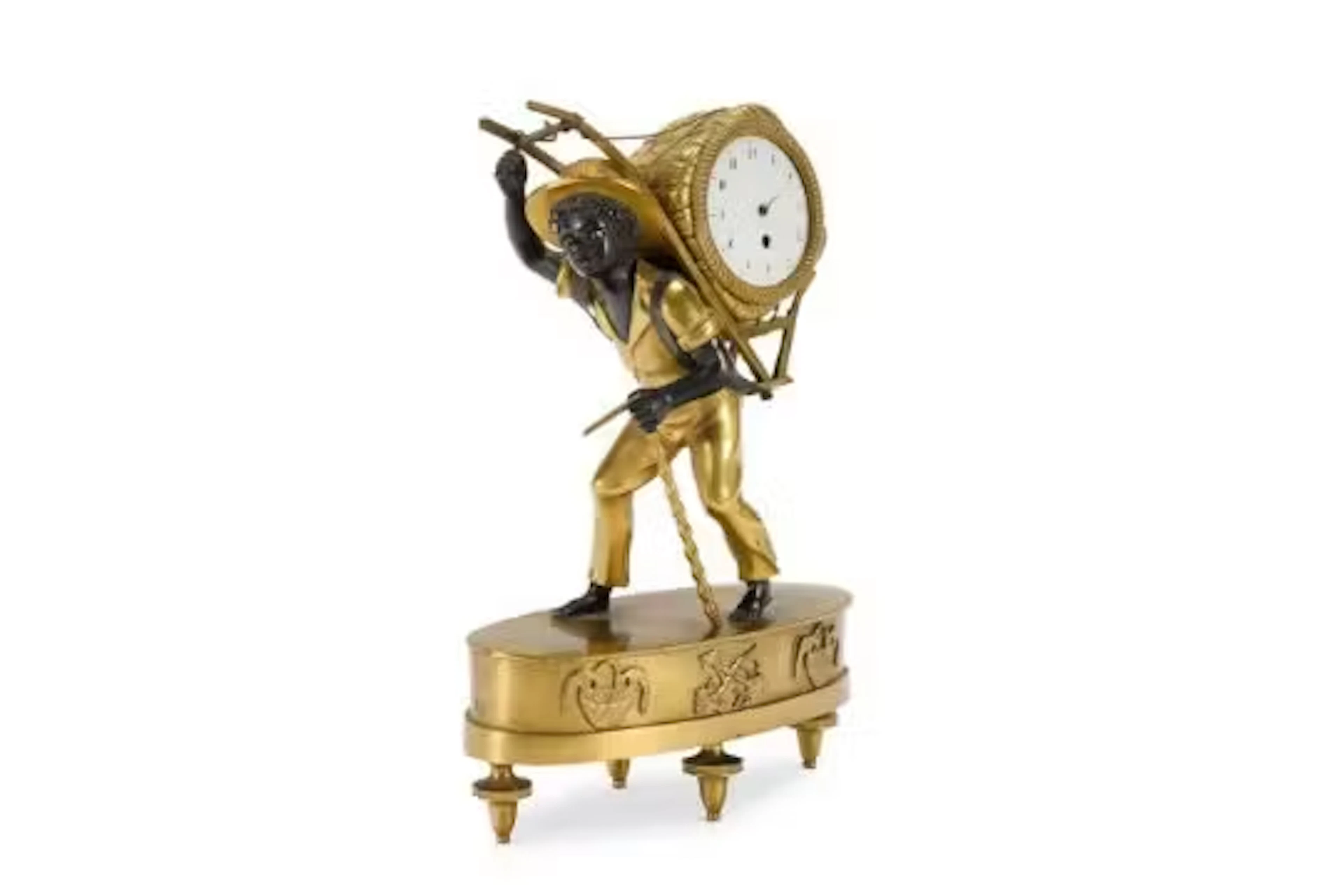 A SECOND EMPIRE GILT AND BRONZED METAL MANTLE TIMEPIECE