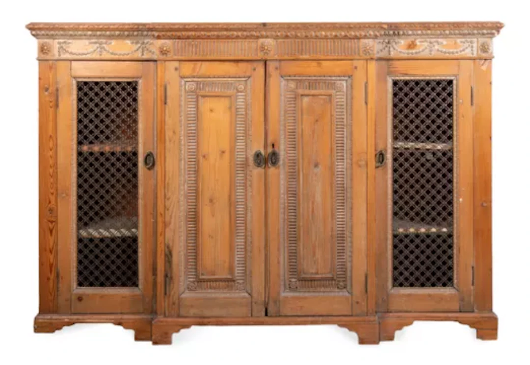 A STRIPPED PINE BREAKFRONT SIDE CABINET OR CHIFFONIER, CIRCA 1810