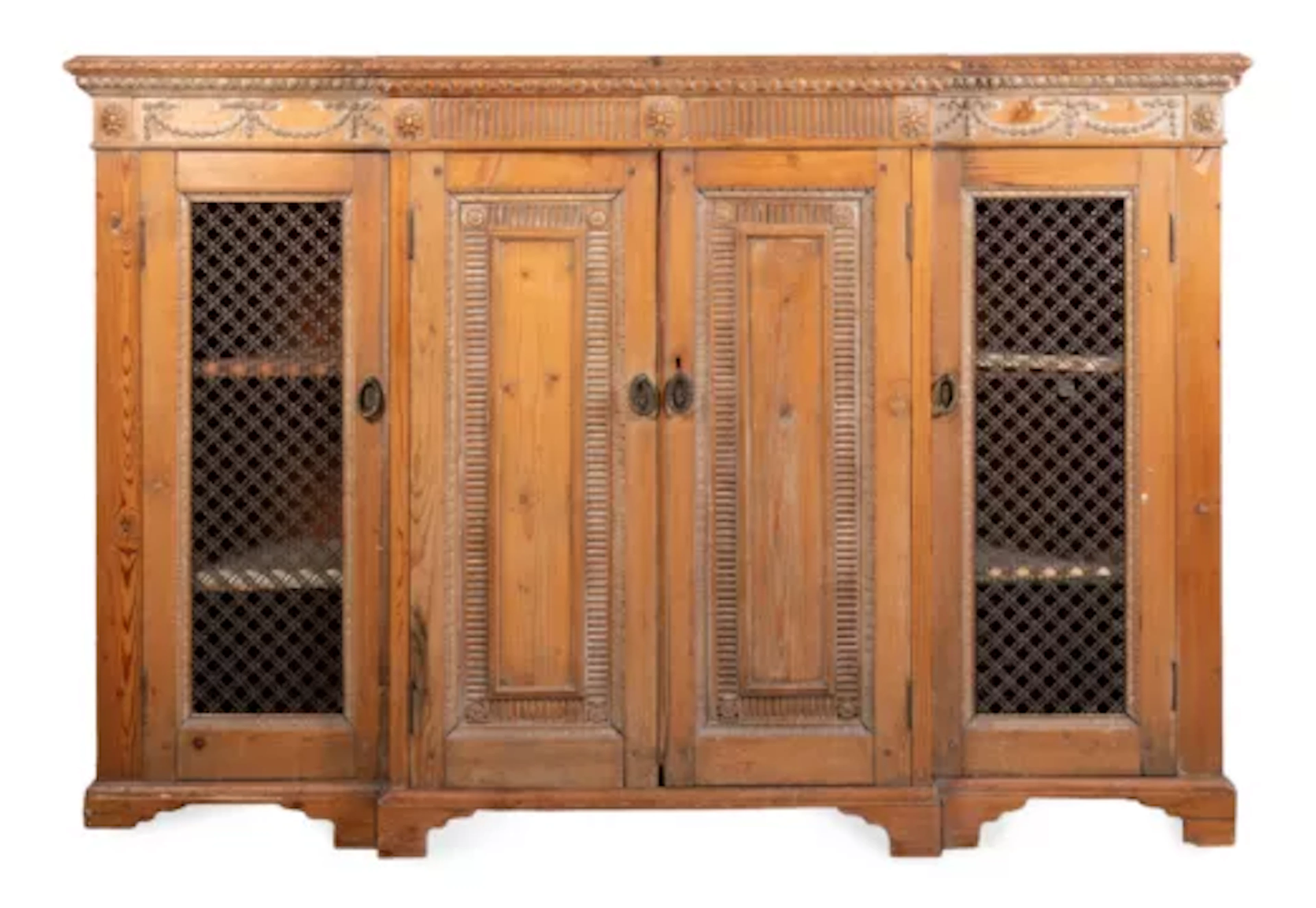 A STRIPPED PINE BREAKFRONT SIDE CABINET OR CHIFFONIER, CIRCA 1810