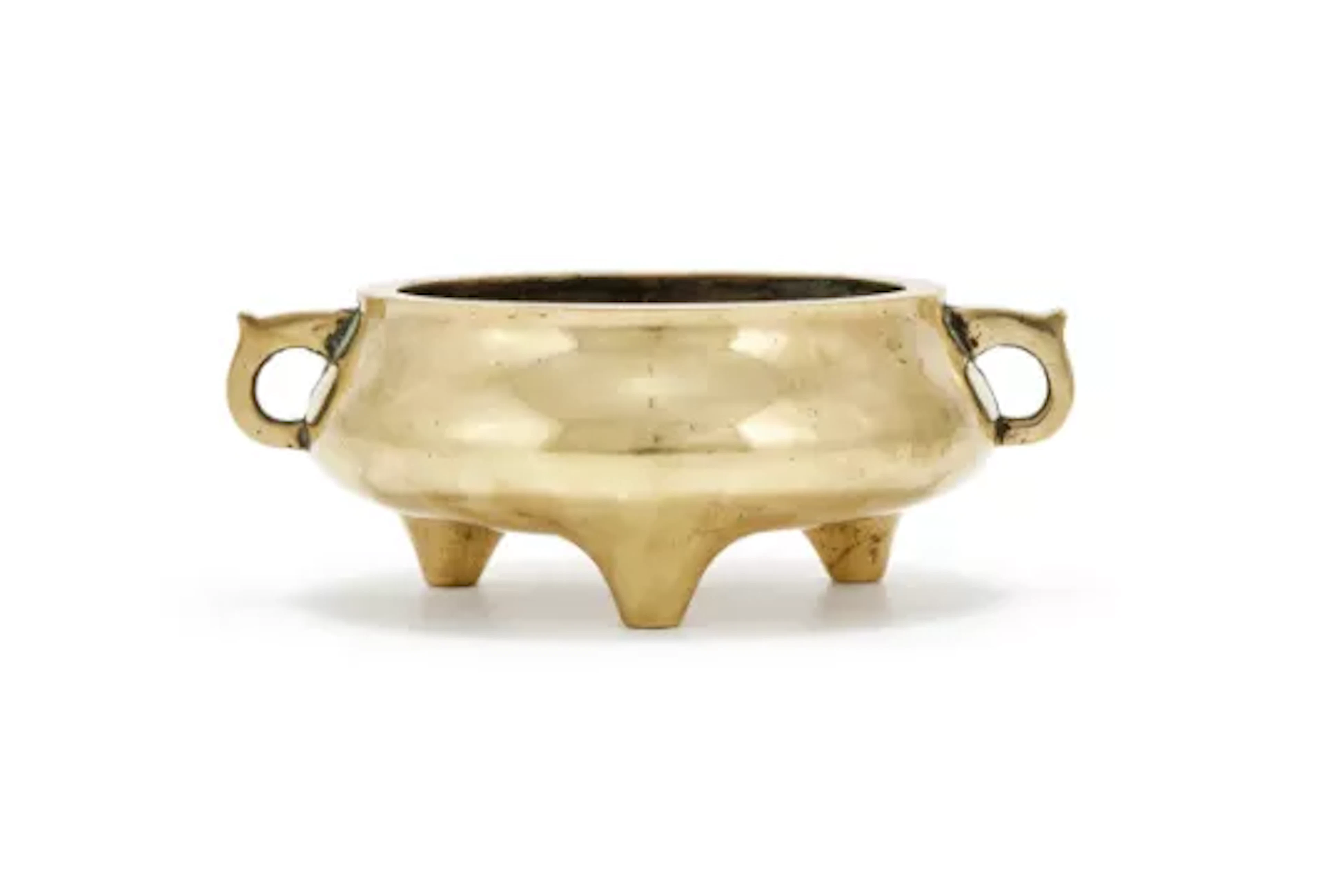 A Chinese bronze twin handled tripod censer, 17th or 18th century