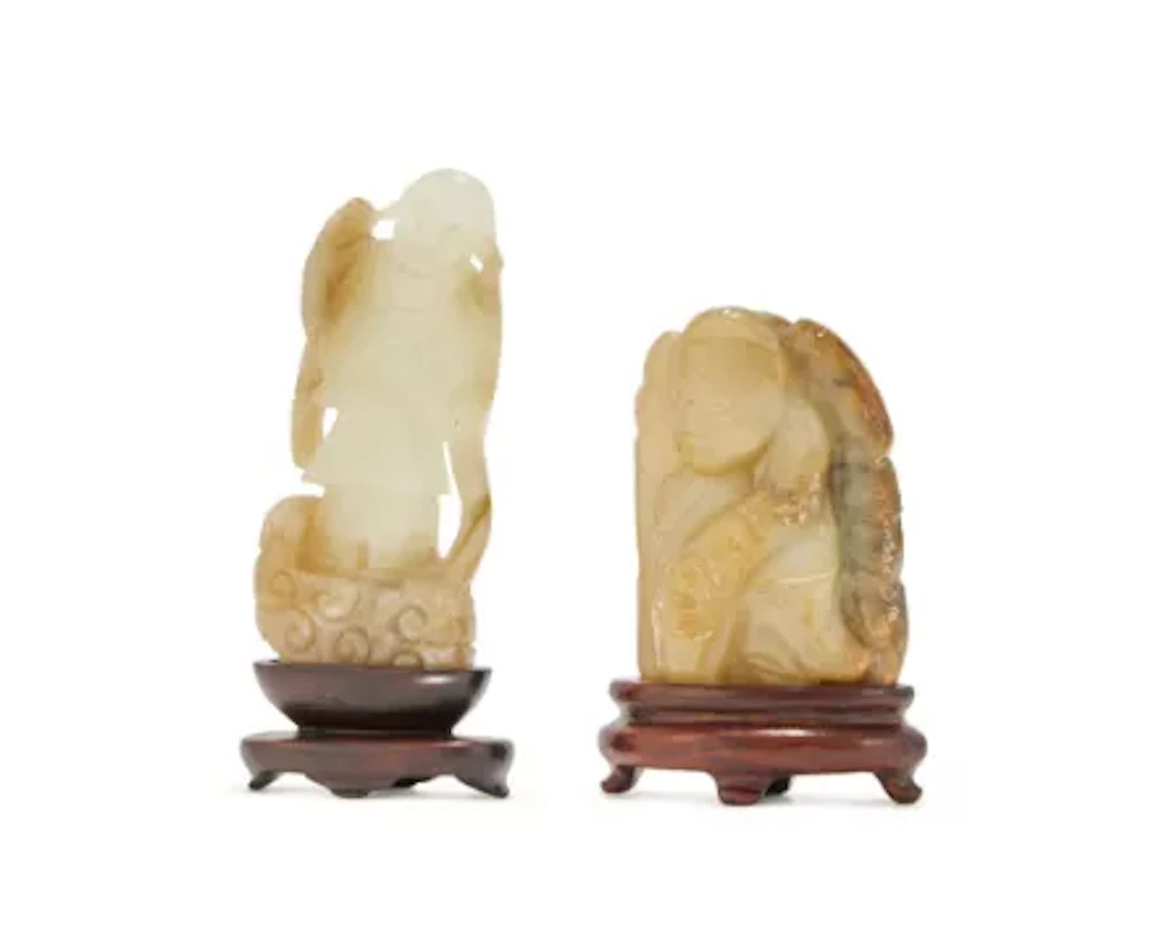 A Chinese carved celadon jade figure of Tanzi, Ming Dynasty