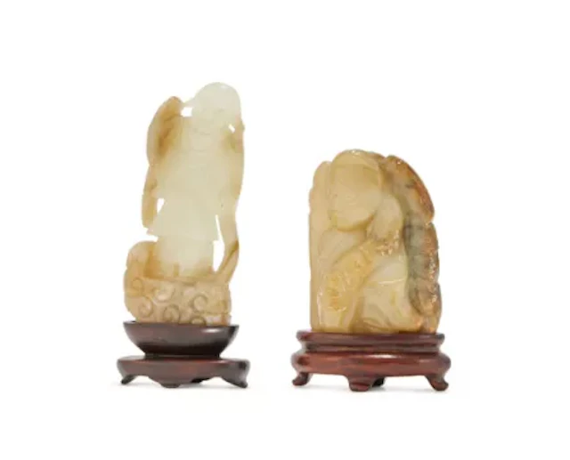A Chinese carved celadon jade figure of Tanzi, Ming Dynasty