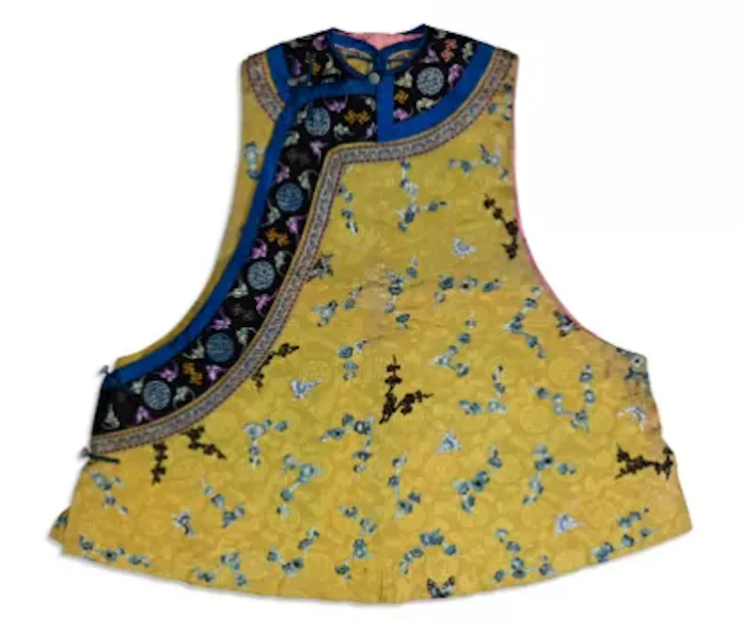 A Manchu Chinese women’s yellow robe altered into a waistcoat
