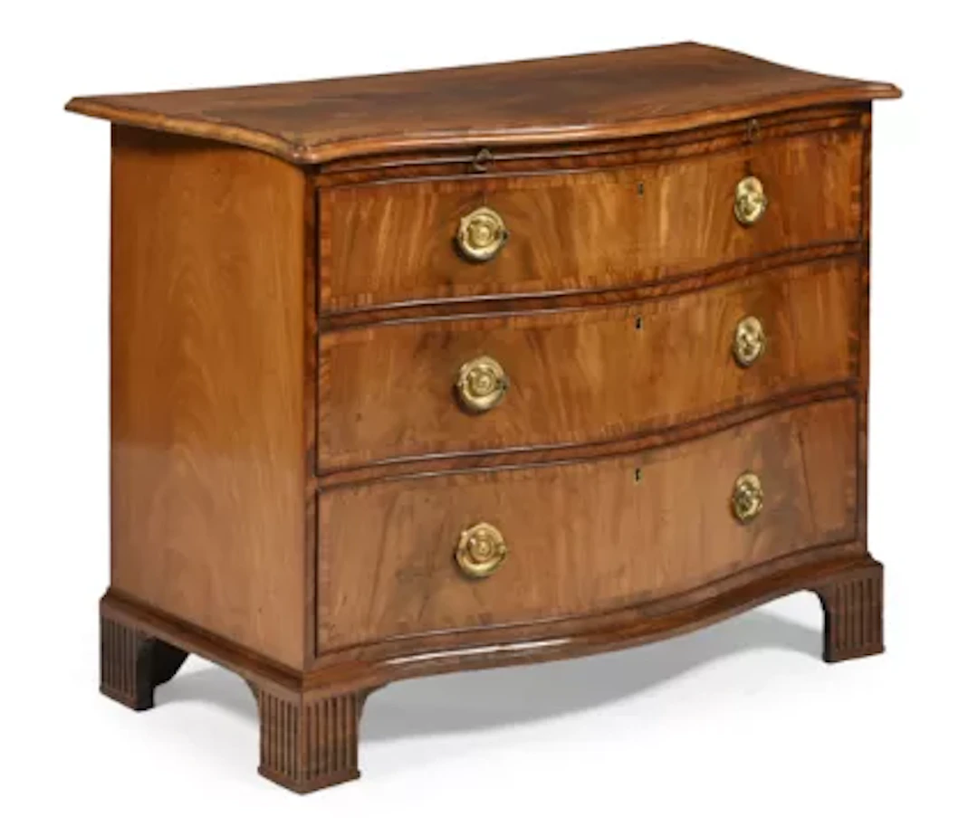 A GEORGE III MAHOGANY AND CROSSBANDED SERPENTINE FRONTED CHEST OF