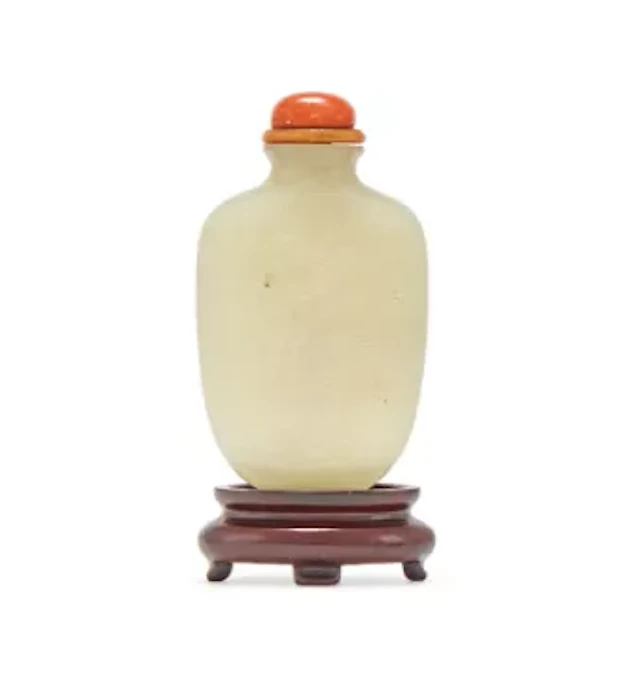 Y A Chinese carved pale celadon jade snuff bottle, 18th century