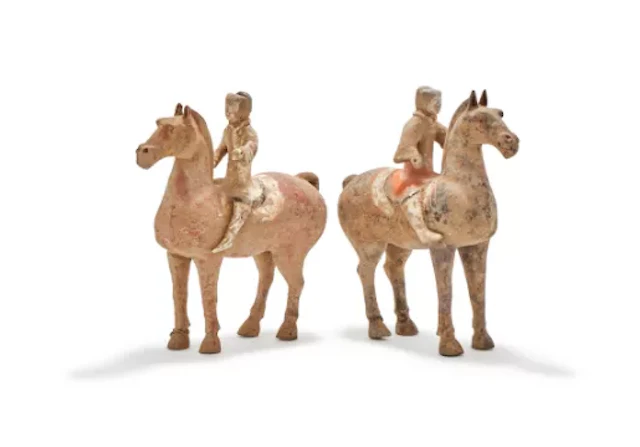 A pair of Chinese pottery horses and riders, presumed Han dynasty