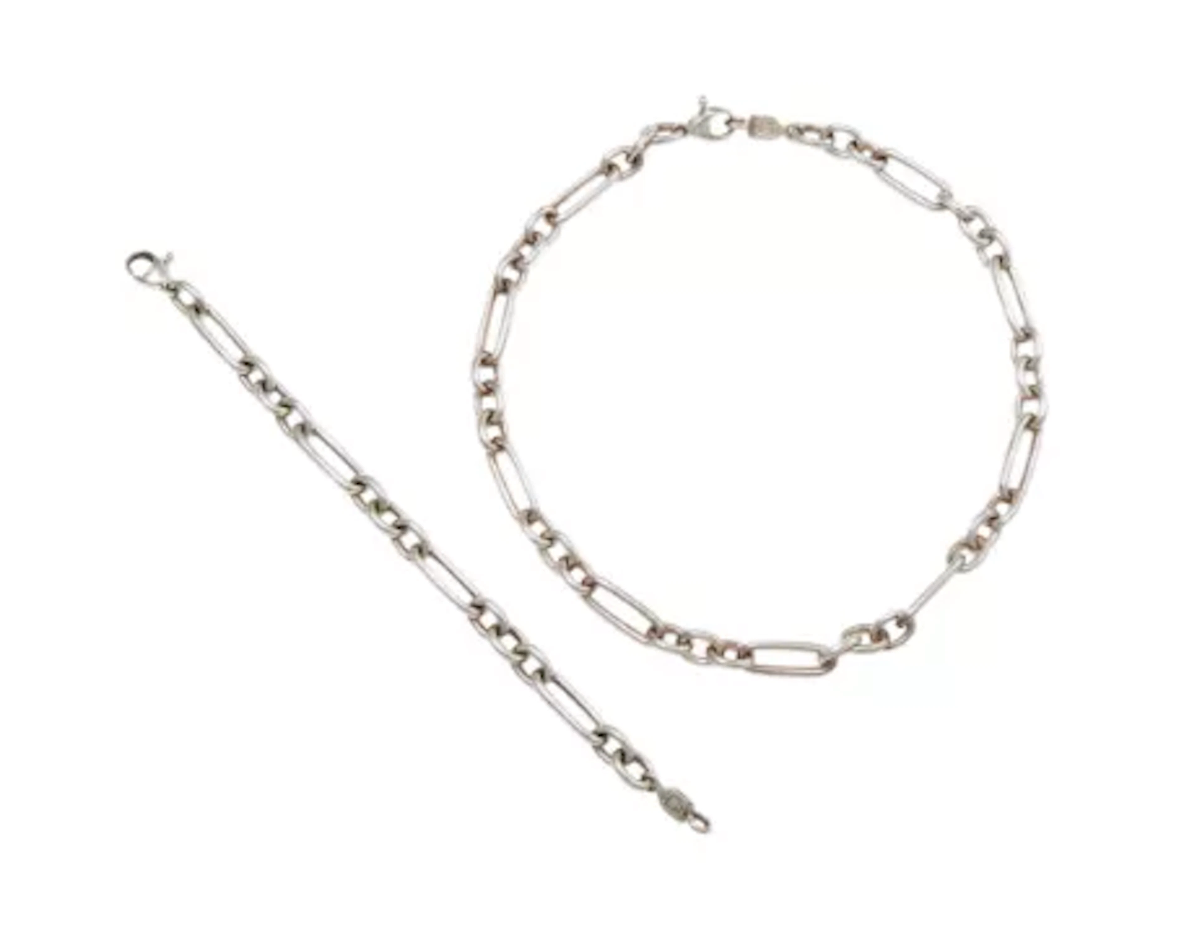 CASSANDRA GOAD, A SILVER 'BEAUMARCHAIS FIGARO' NECKLACE AND BRACELET