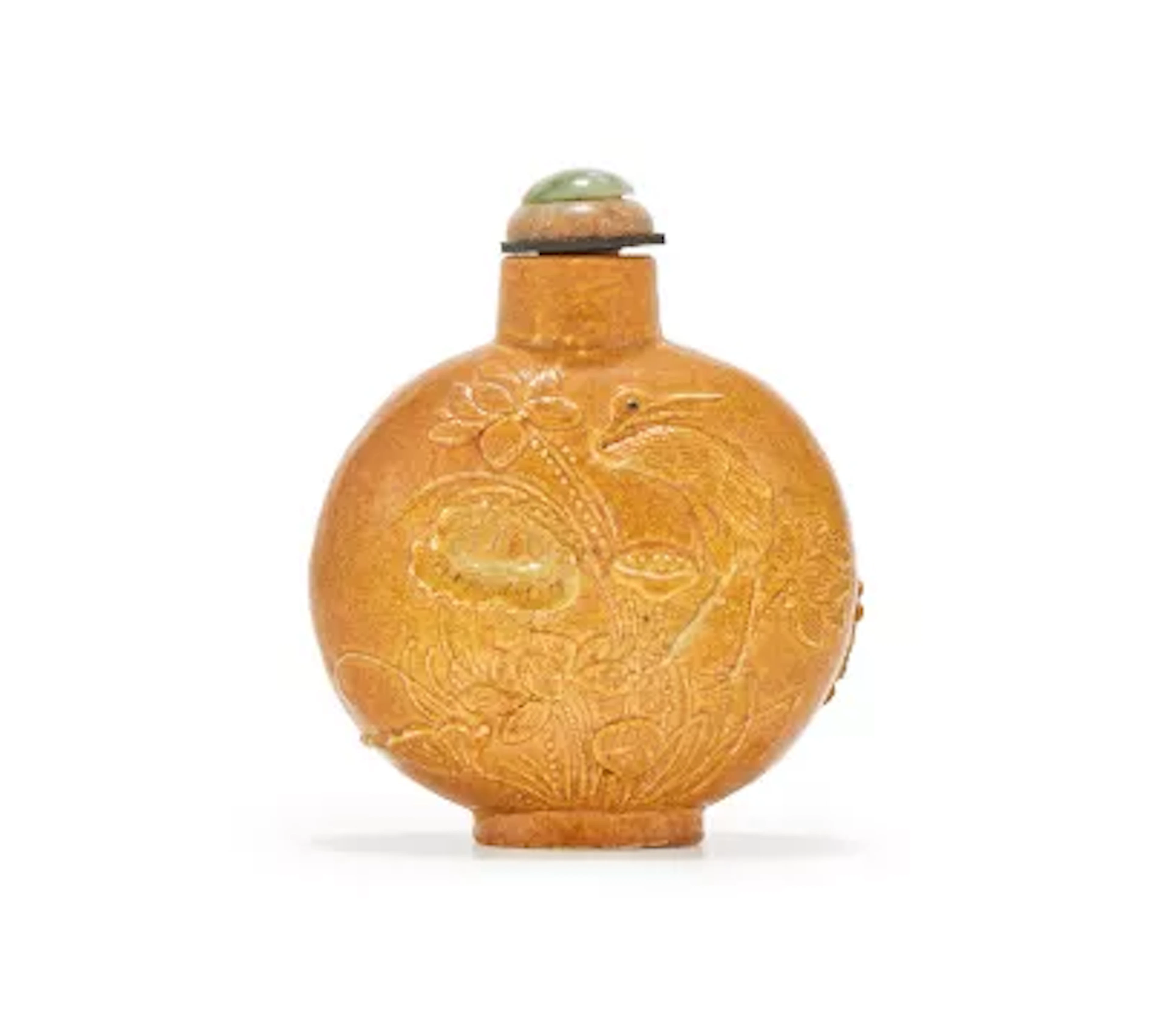 A Chinese moulded brown glazed 'Lotus pond and egret' snuff bottle