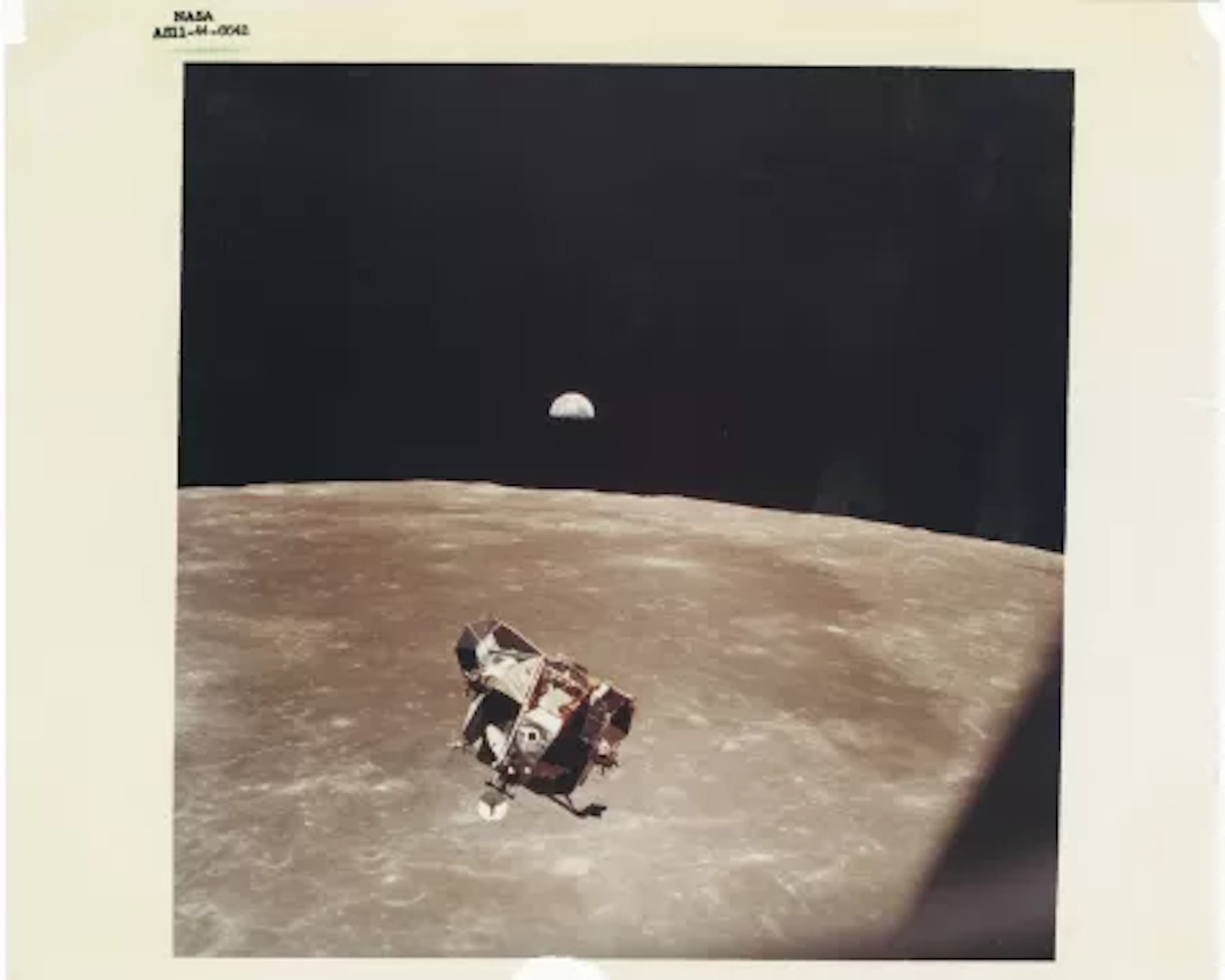 [Apollo 11] THE LUNAR MODULE "EAGLE" FRAMED BY A MAJESTIC EARTHRISE