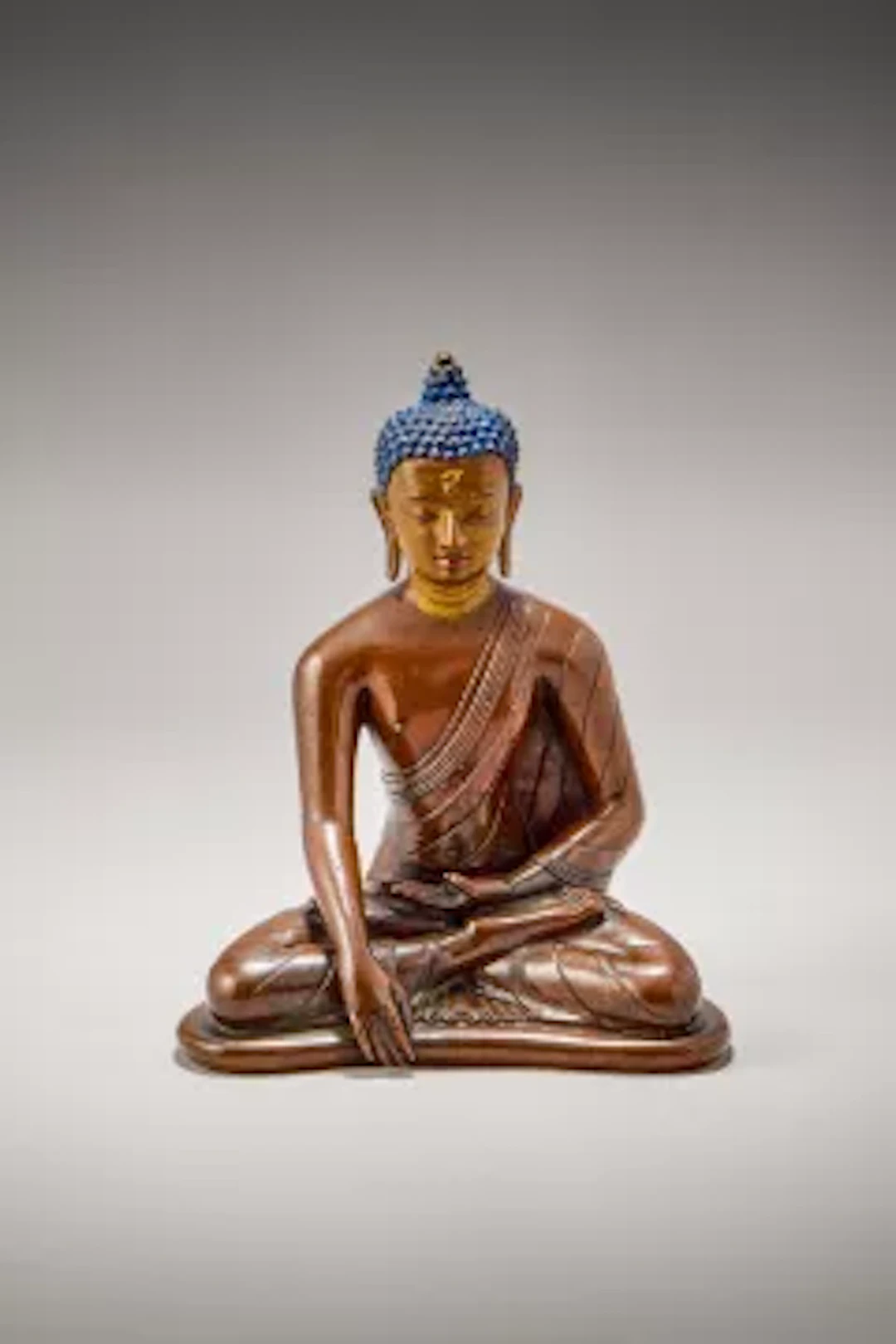 A fine Tibetan bronze figure of Shakyamuni Buddha, 16th century