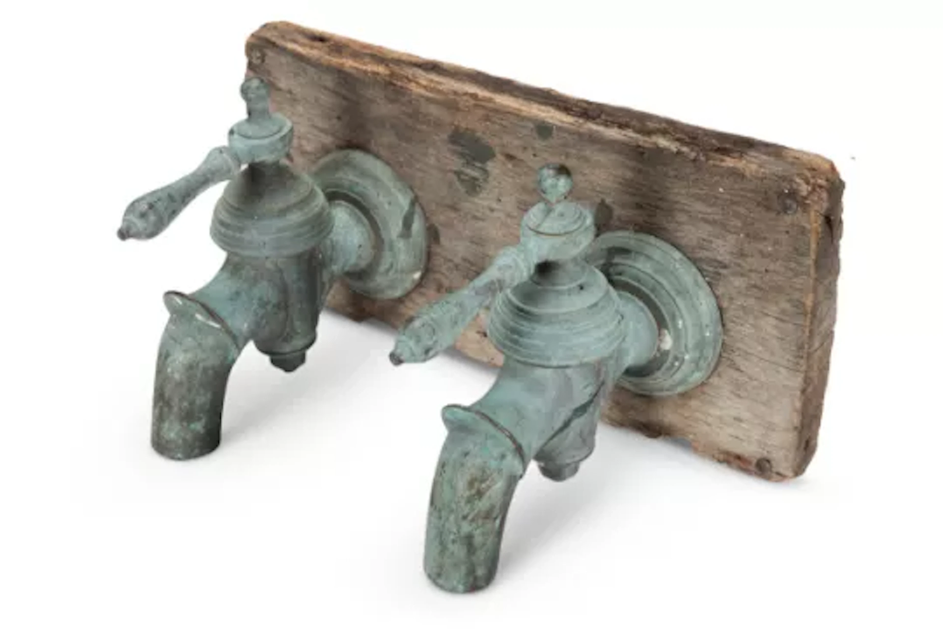 A PAIR OF BRONZE TAPS, 19TH CENTURY