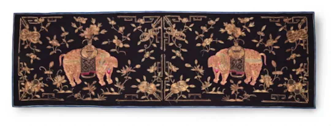 An elaborate Chinese silk twinned Elephant panel, embroidered in gold thread