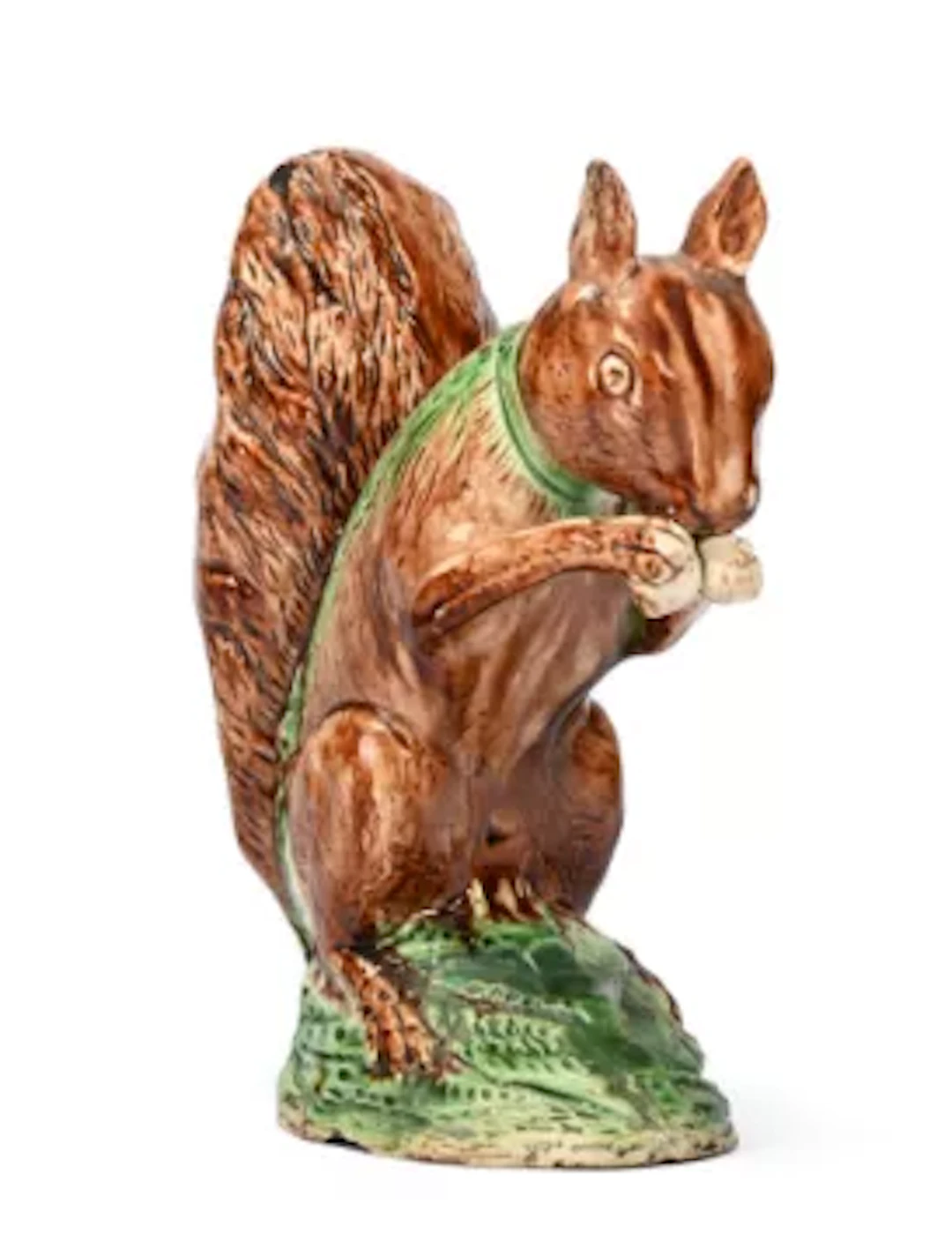 A STAFFORDSHIRE CREAMWARE MODEL OF A SQUIRREL EATING A NUT, CIRCA 1780