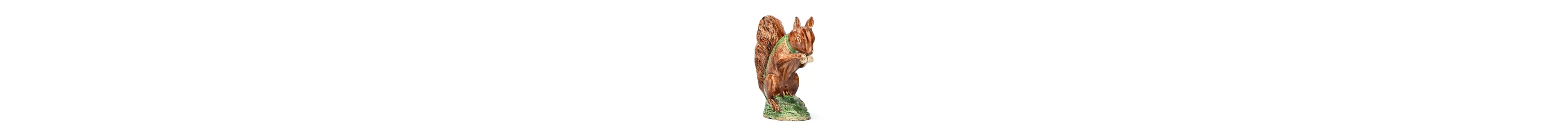 A STAFFORDSHIRE CREAMWARE MODEL OF A SQUIRREL EATING A NUT, CIRCA 1780