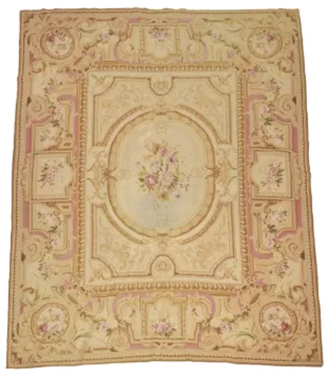 AN AUBUSSON STYLE NEEDLE POINT CARPET OF FORMAL NEO-CLASSICAL DESIGN