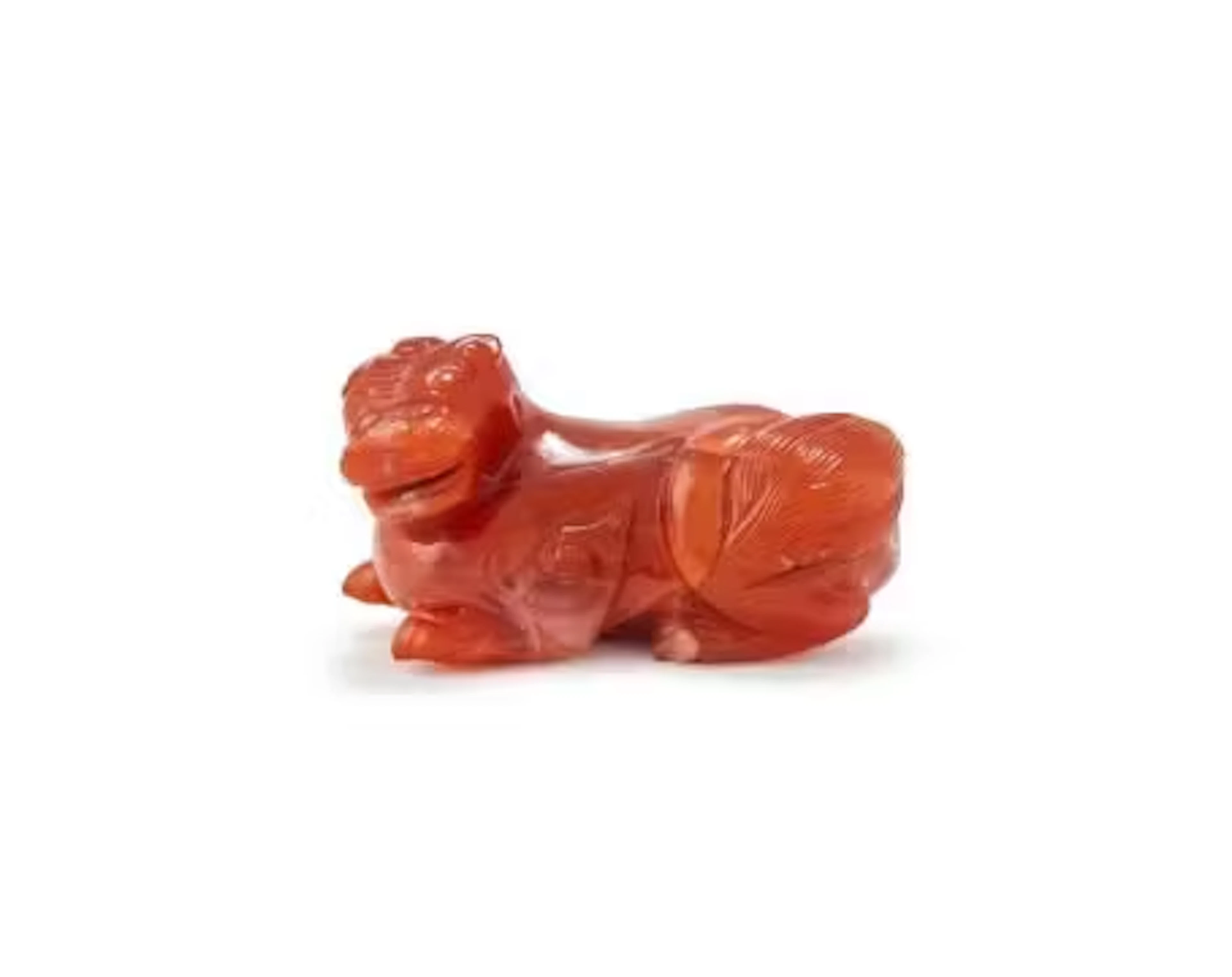 A Chinese carnelian agate carving of a recumbent single horned beast