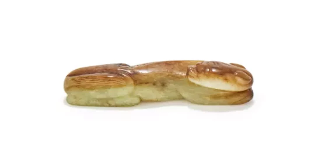 A Chinese yellow jade model of a tiger, Song or Ming Dynasty