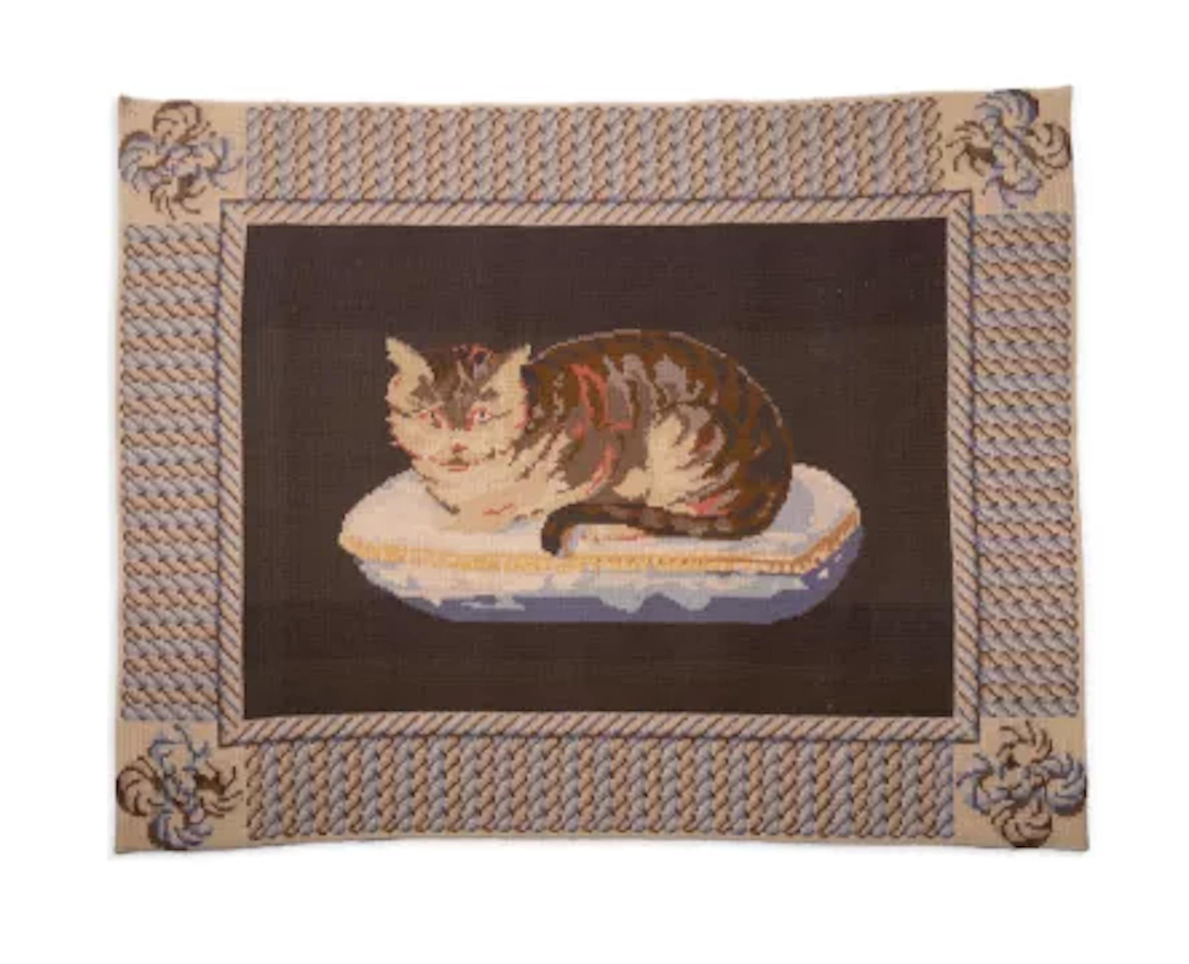 A CROSS-STITCH NEEDLEWORK RUG DEPICTING A CAT, HAND WOVEN IN PORTUGAL