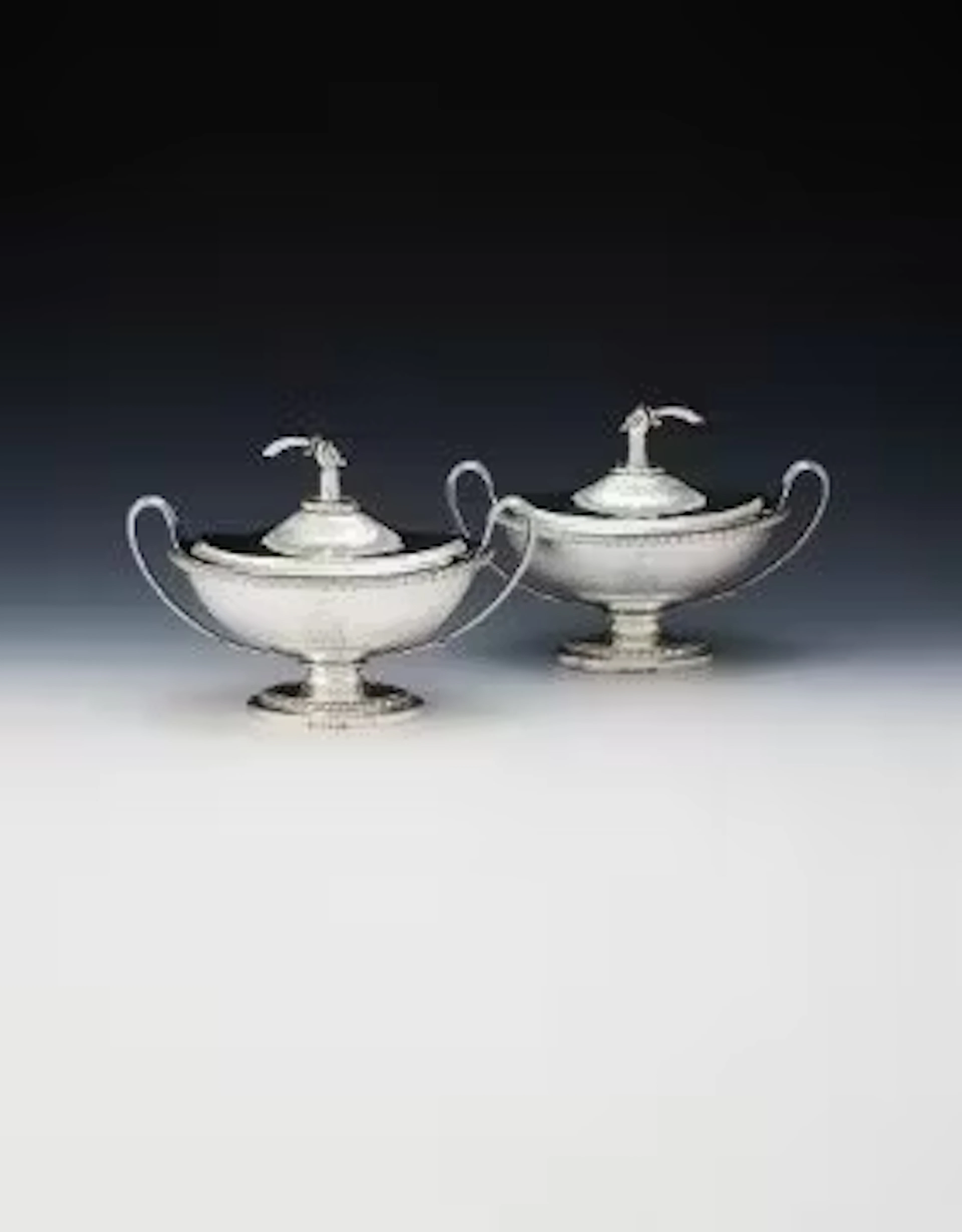 A PAIR OF GEORGE III SILVER SAUCE TUREENS