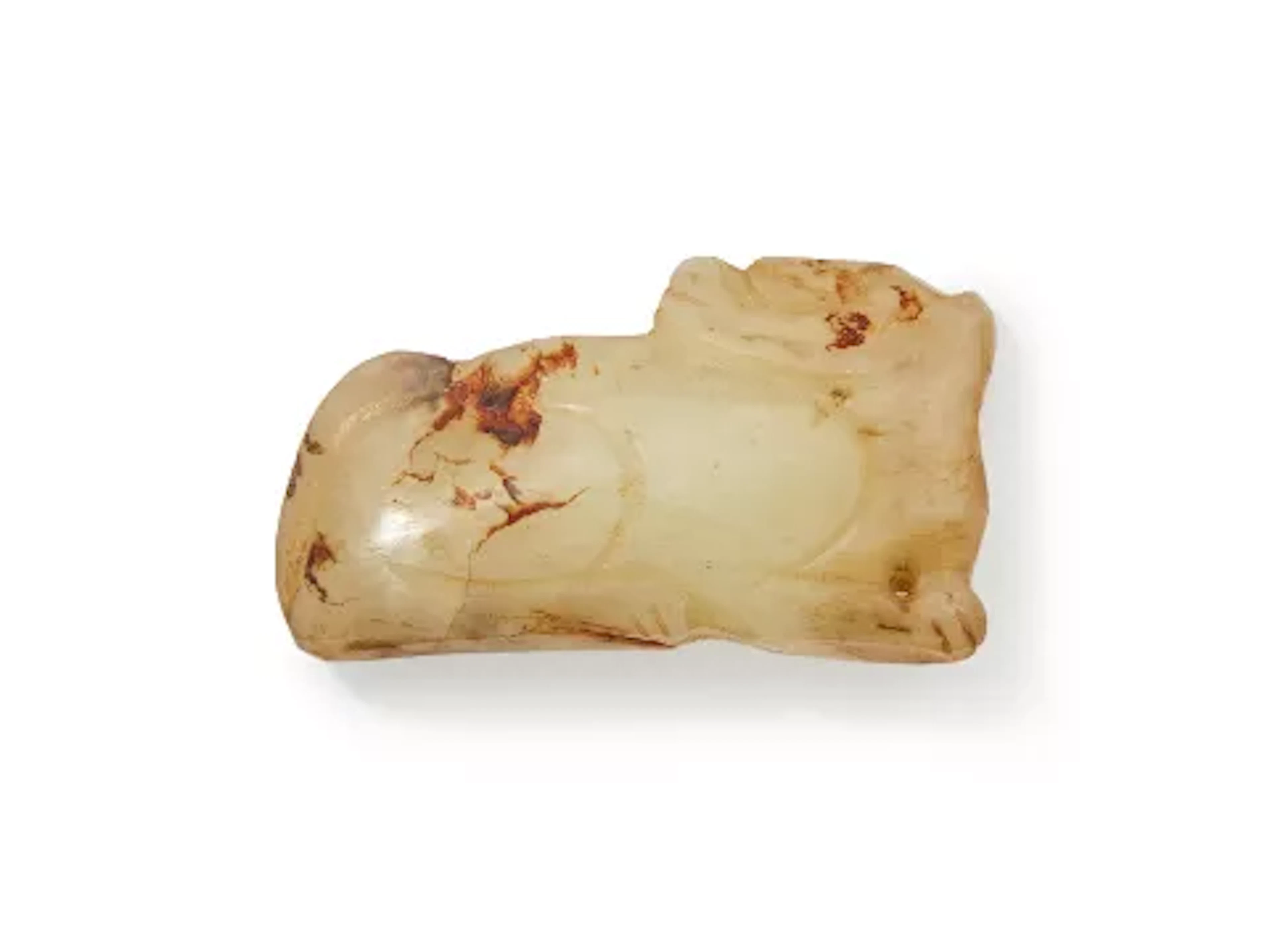 A Chinese pale celadon jade carving of a recumbent beast, Ming Dynasty
