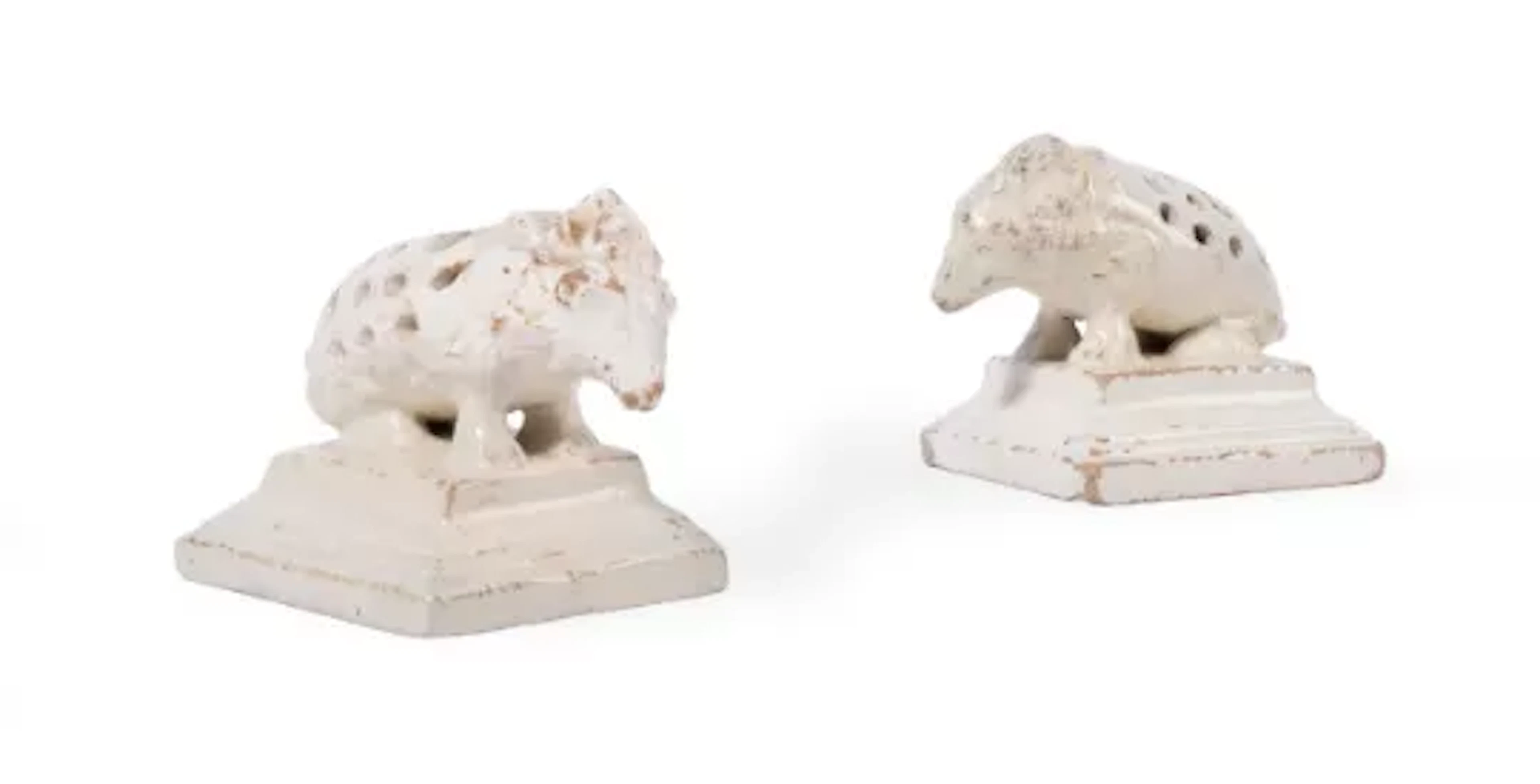 A PAIR OF ENGLISH CREAM COLOURED POTTERY PORCUPINE TOOTHPICK HOLDERS