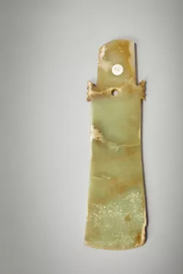A Chinese large celadon jade ceremonial axe, qi, Neolithic period