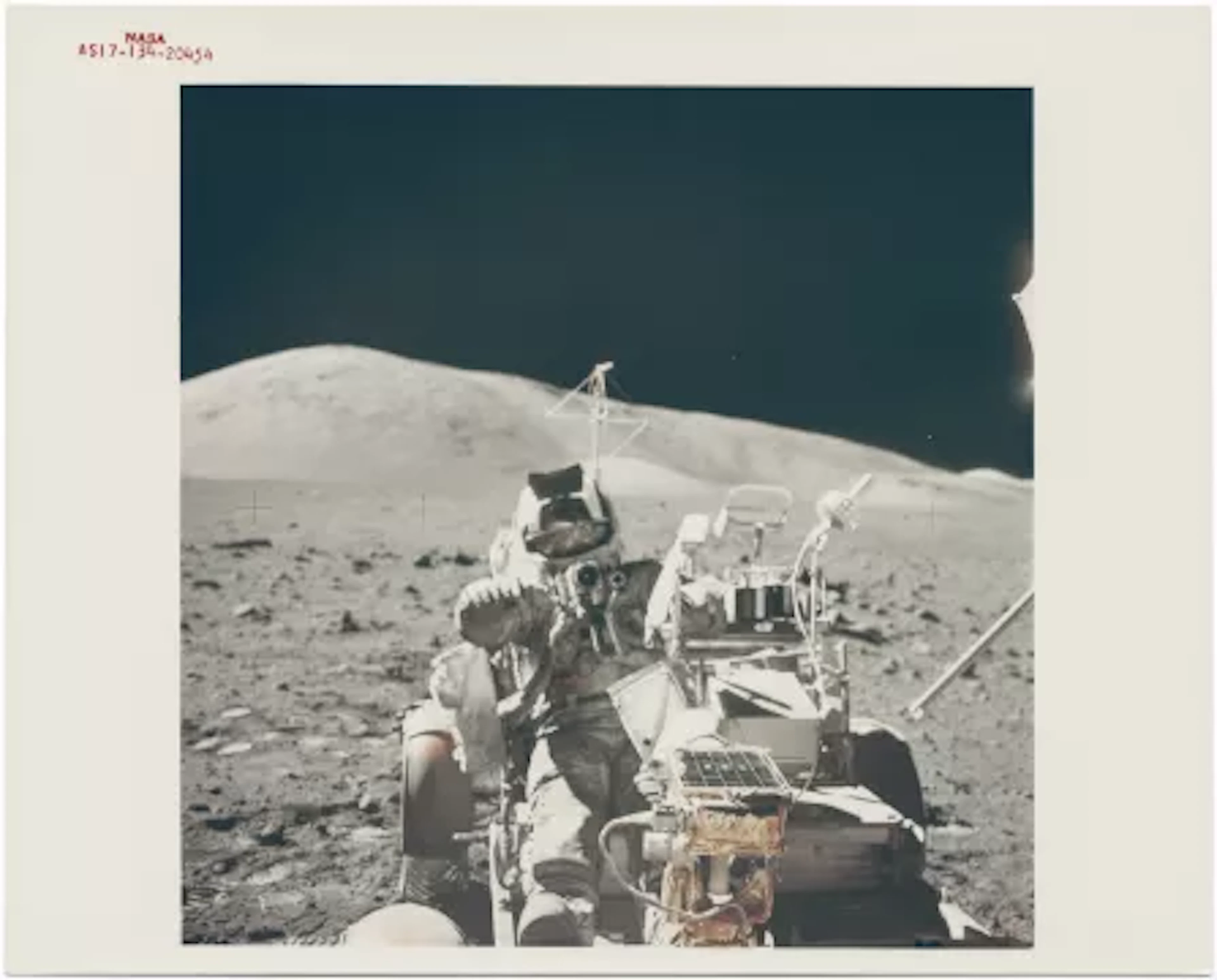 [Apollo 17] HARRISON SCHMITT MOUNTING THE ROVER FOR ONE LAST RIDE