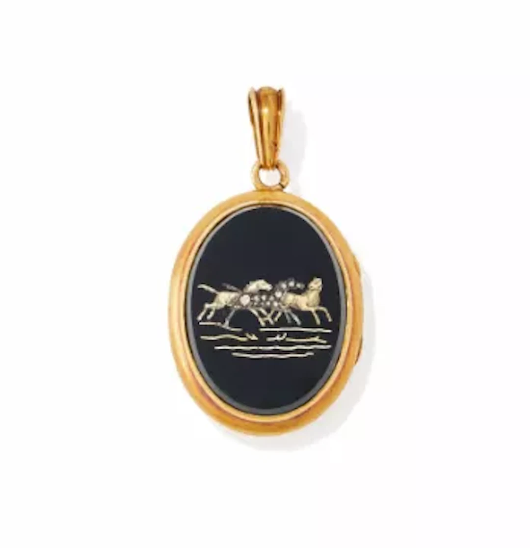 AN 1860S ONYX AND DIAMOND LOCKET