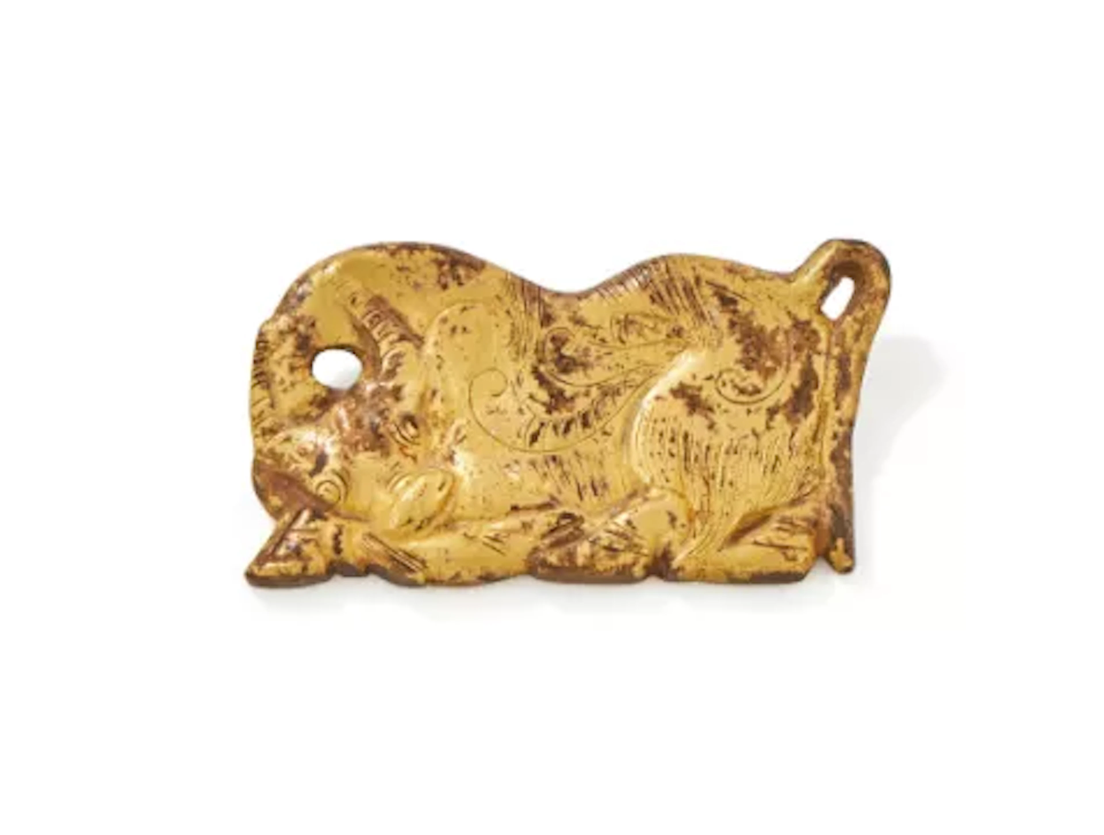 A Chinese gilt bronze belt plaque in the shape of a yak, North China
