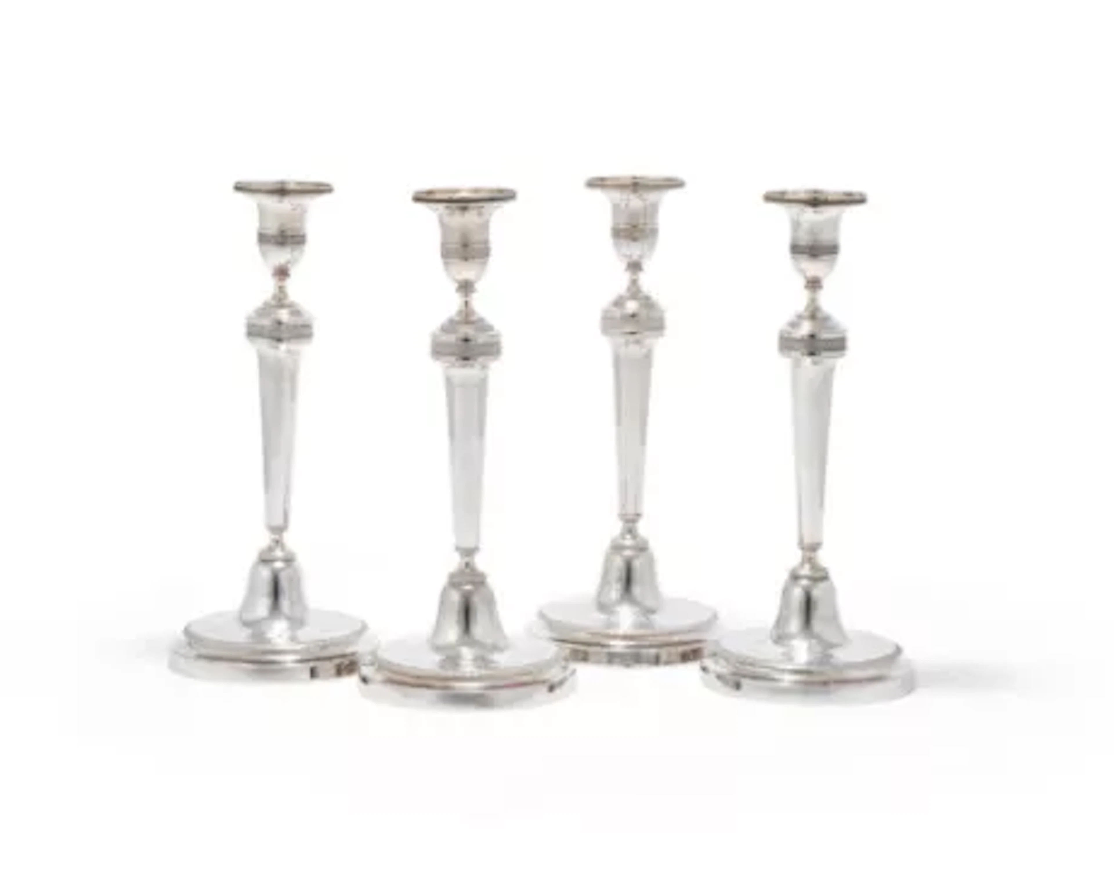 A SET OF FOUR FRENCH EMPIRE SILVER CANDLESTICKS, PARIS, .950 STANDARD