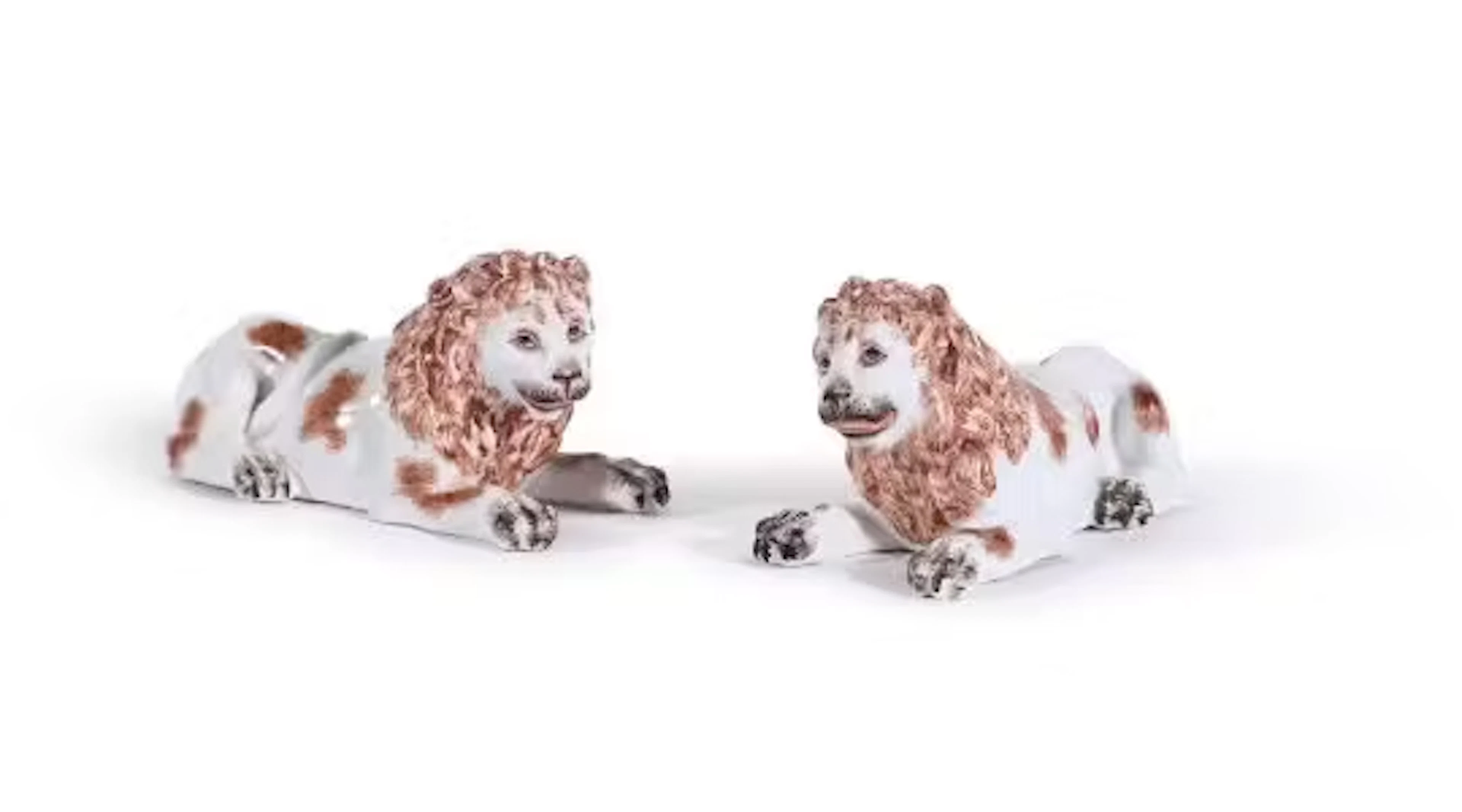 A PAIR OF GILT METAL MOUNTED EDME SAMSON PORCELAIN MODELS OF RECUMBENT