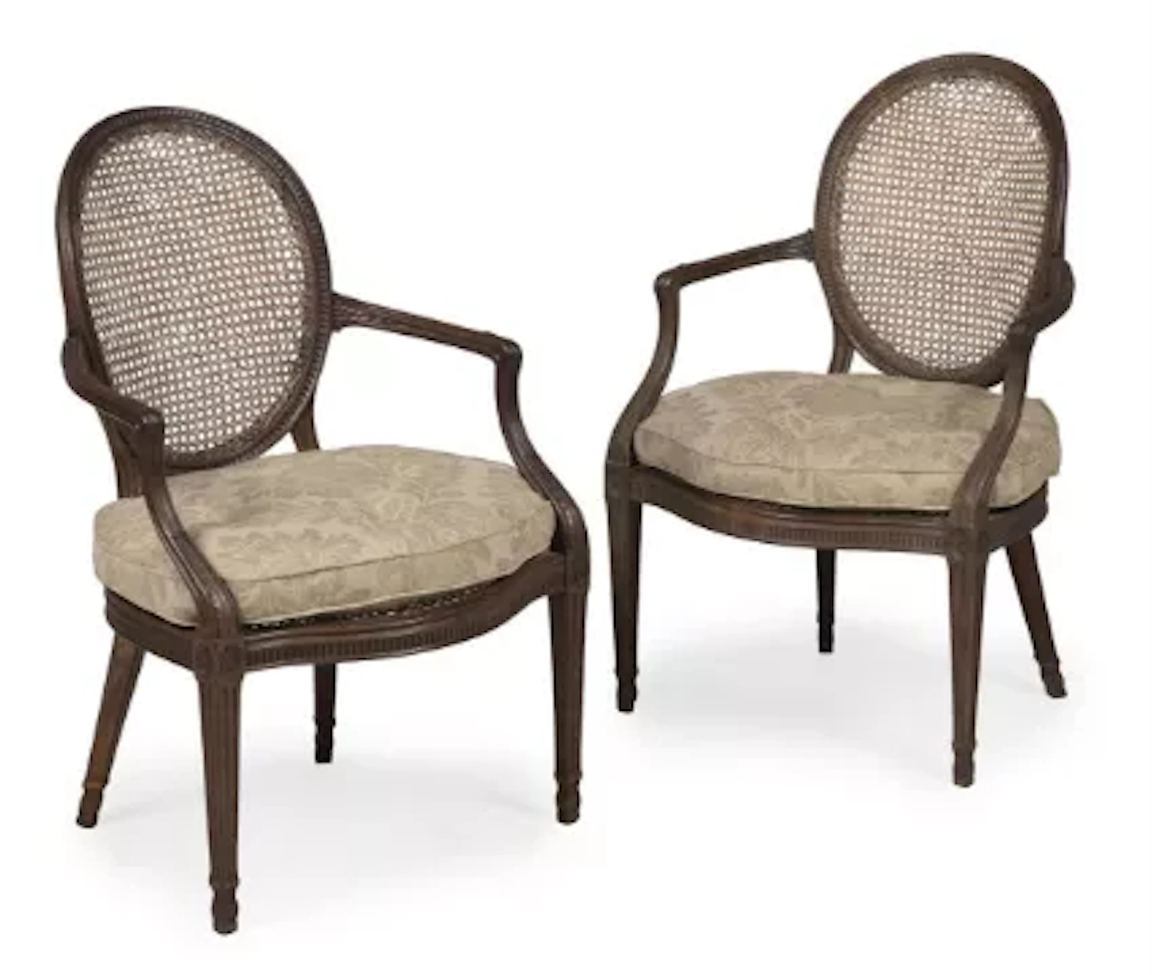 A PAIR OF GEORGE III MAHOGANY LIBRARY ARMCHAIRS, IN THE MANNER OF