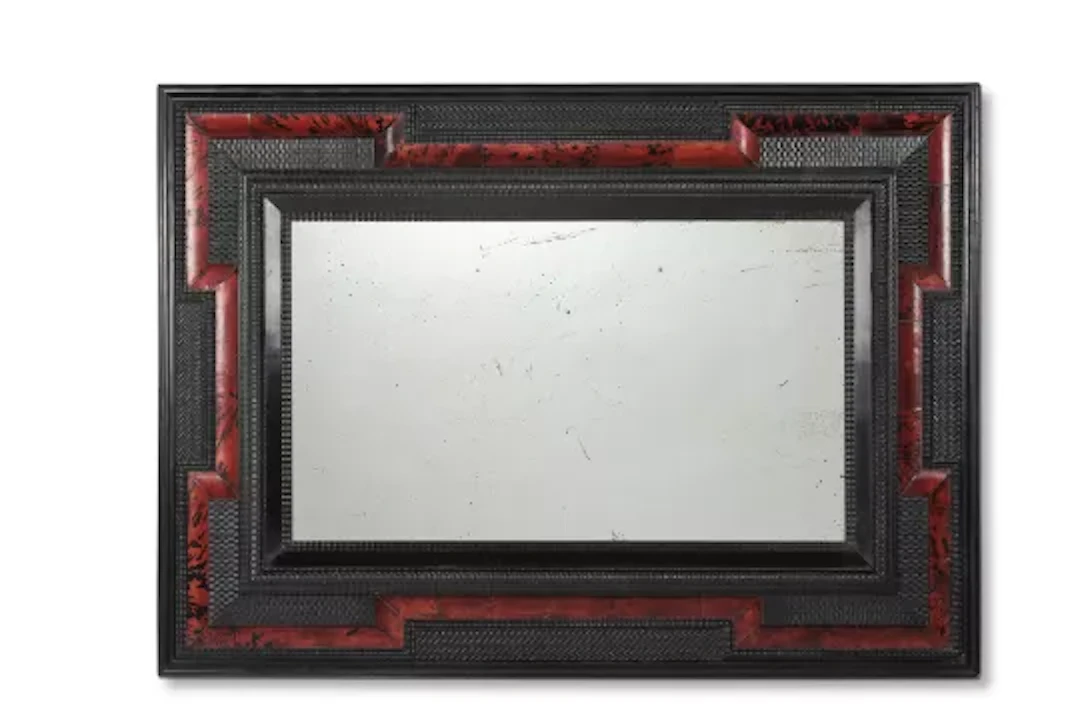Y A RIPPLE MOULDED EBONISED AND TORTOISESHELL MIRROR, DUTCH, 19TH CENTURY